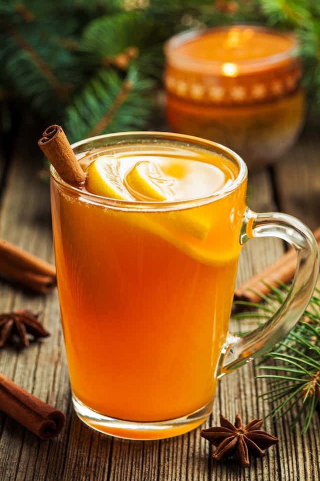 amber spiced drink, glass mug, cinnamon stick, SD Phone Wallpaper
