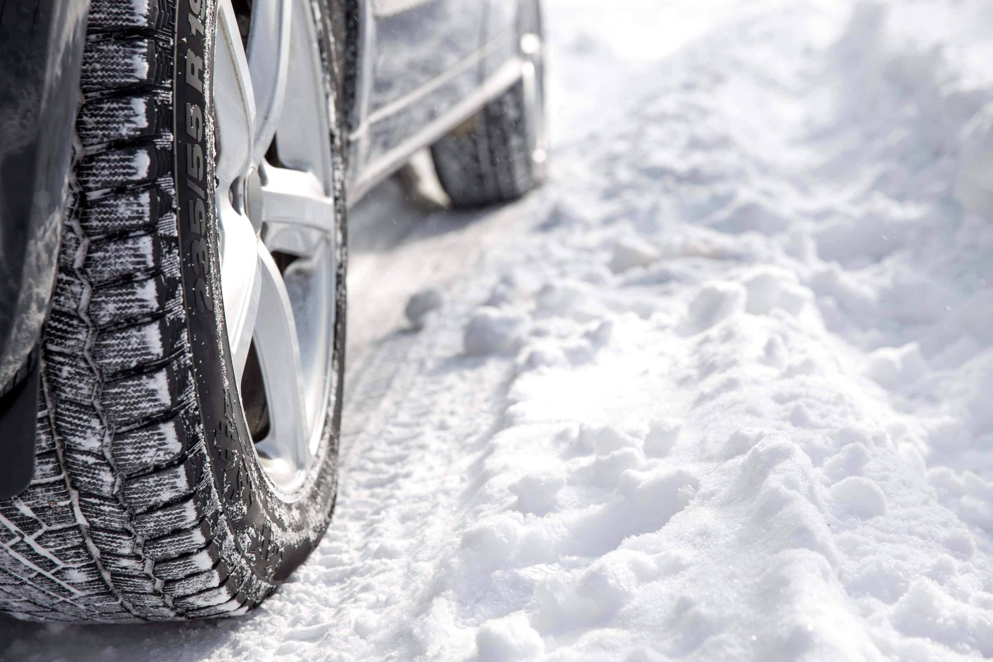 snow-covered winter tire, snowy road, silver car, 2K Desktop Wallpaper