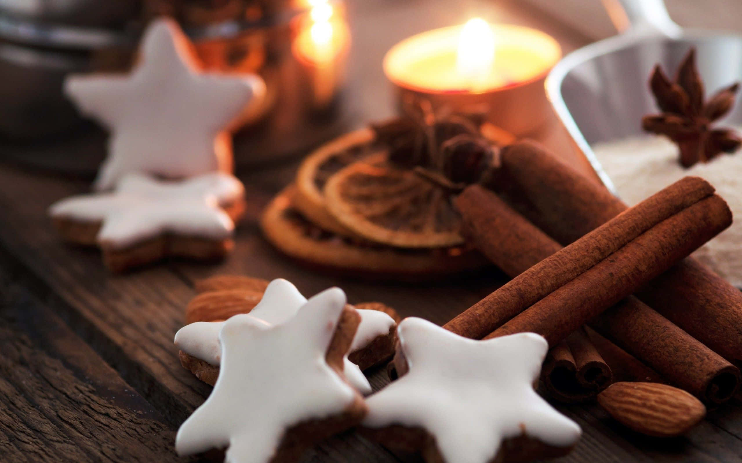 Star-shaped gingerbread cookies, white icing, dark wooden table, 2K Desktop Wallpaper