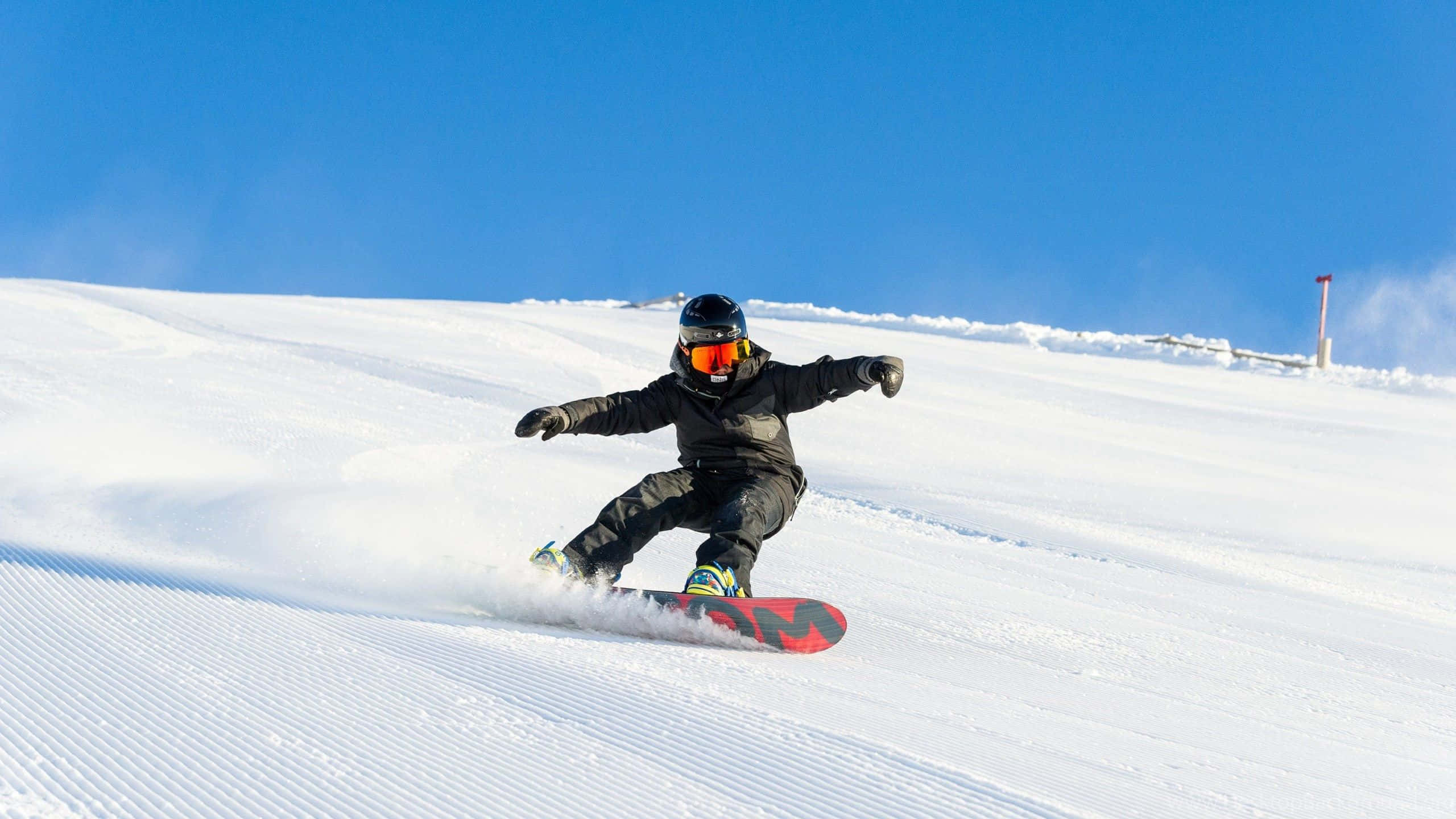 snowboarder, groomed snow, clear blue sky, 2K Desktop Wallpaper