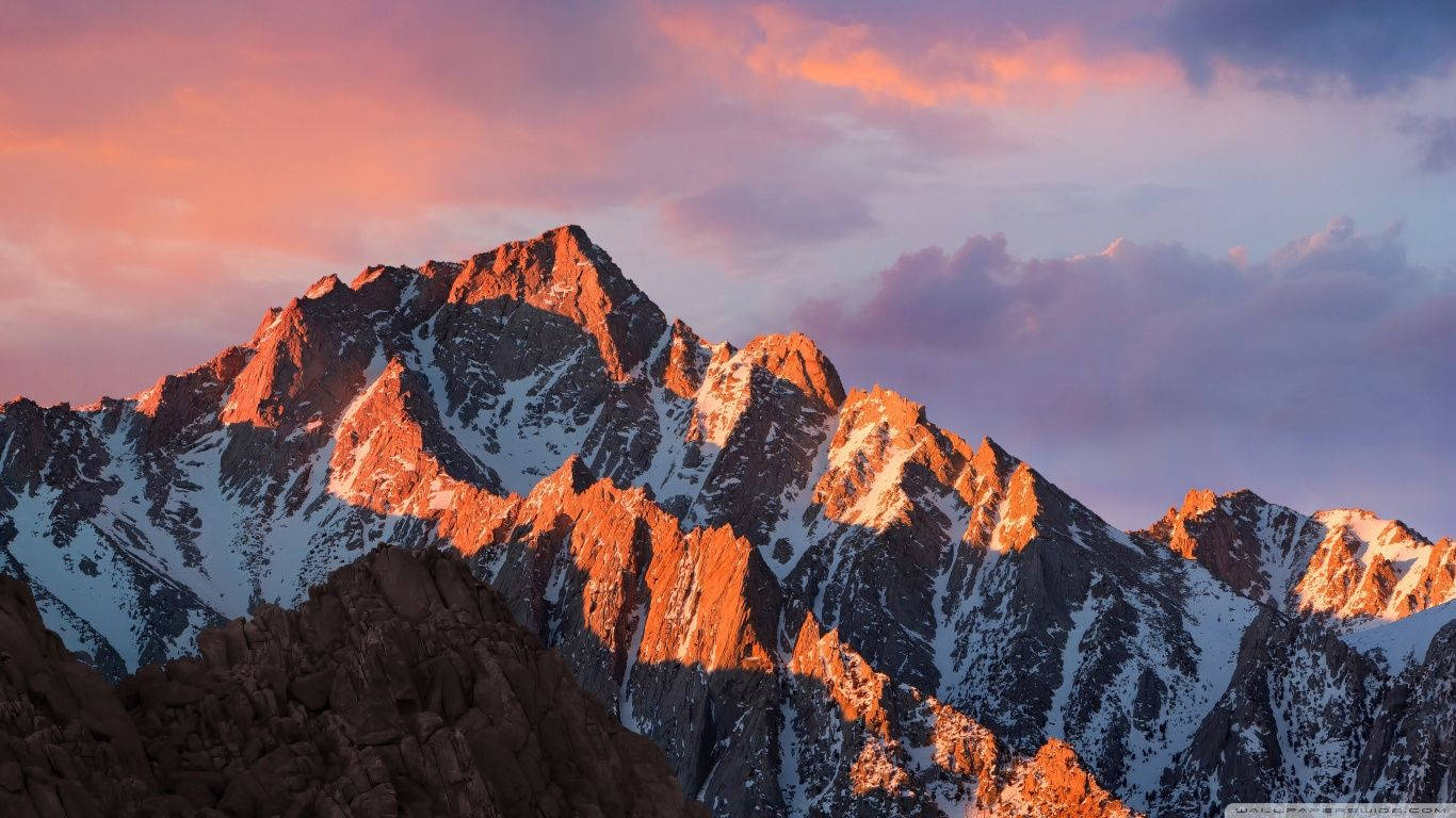 snowcapped mountain peaks, warm orange light, pink and purple sunset sky, HD Desktop Wallpaper