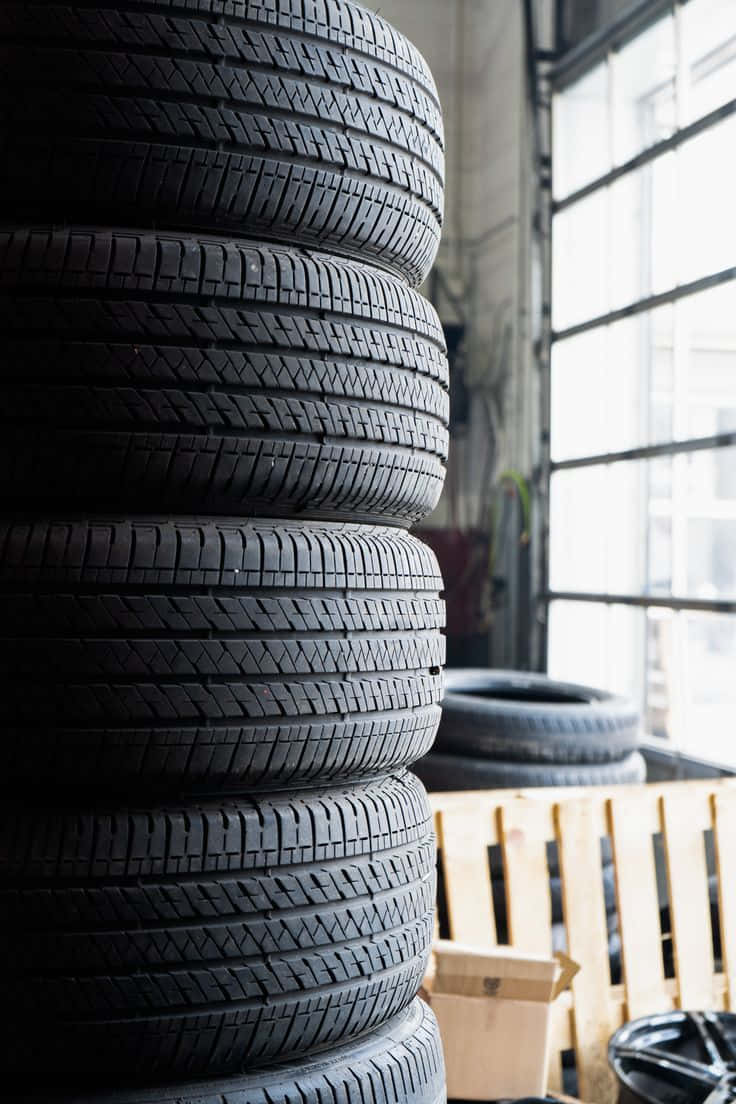 winter tires, black car tires, sunlit industrial garage, SD Phone Wallpaper