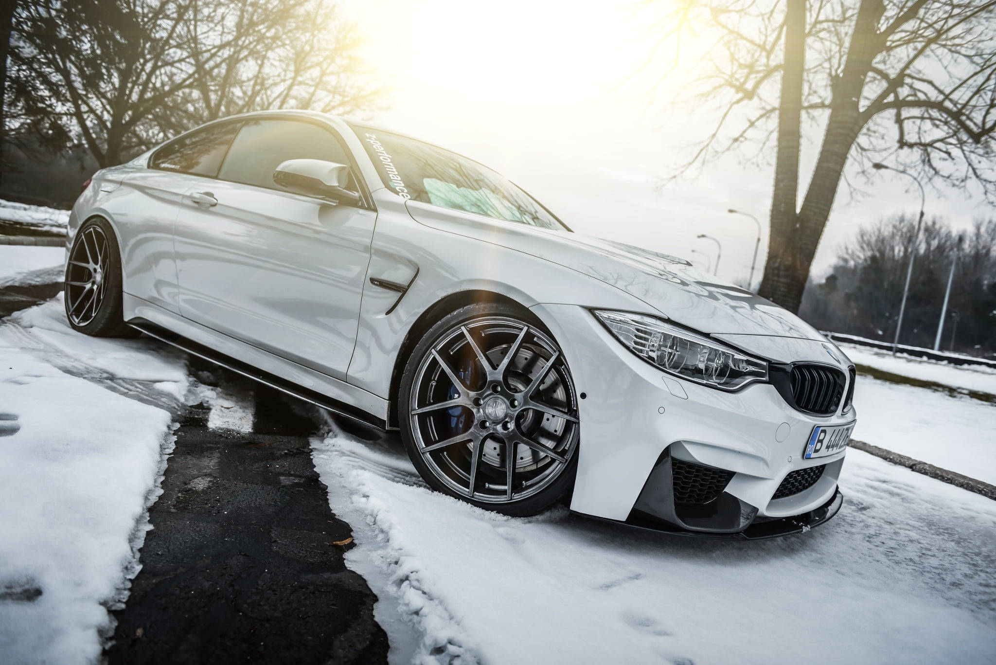 sleek white M4 BMW, snowy roadside, bare trees, Full HD Desktop Wallpaper