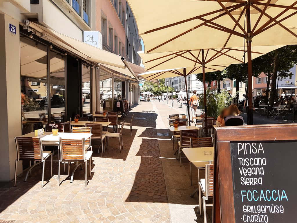 Winterthur, sunlit outdoor café terrace, wooden tables, SD Desktop Wallpaper