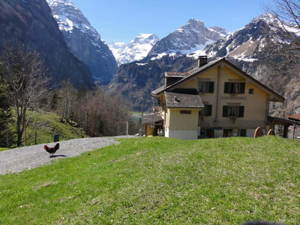 Winterthur, yellow alpine chalet, snow-capped peaks, SD Desktop Wallpaper