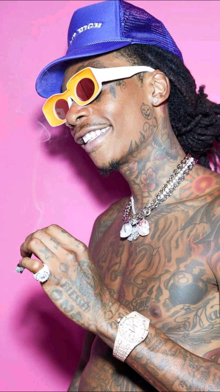 Wiz Khalifa, pink background, blue cap, HD Phone Wallpaper