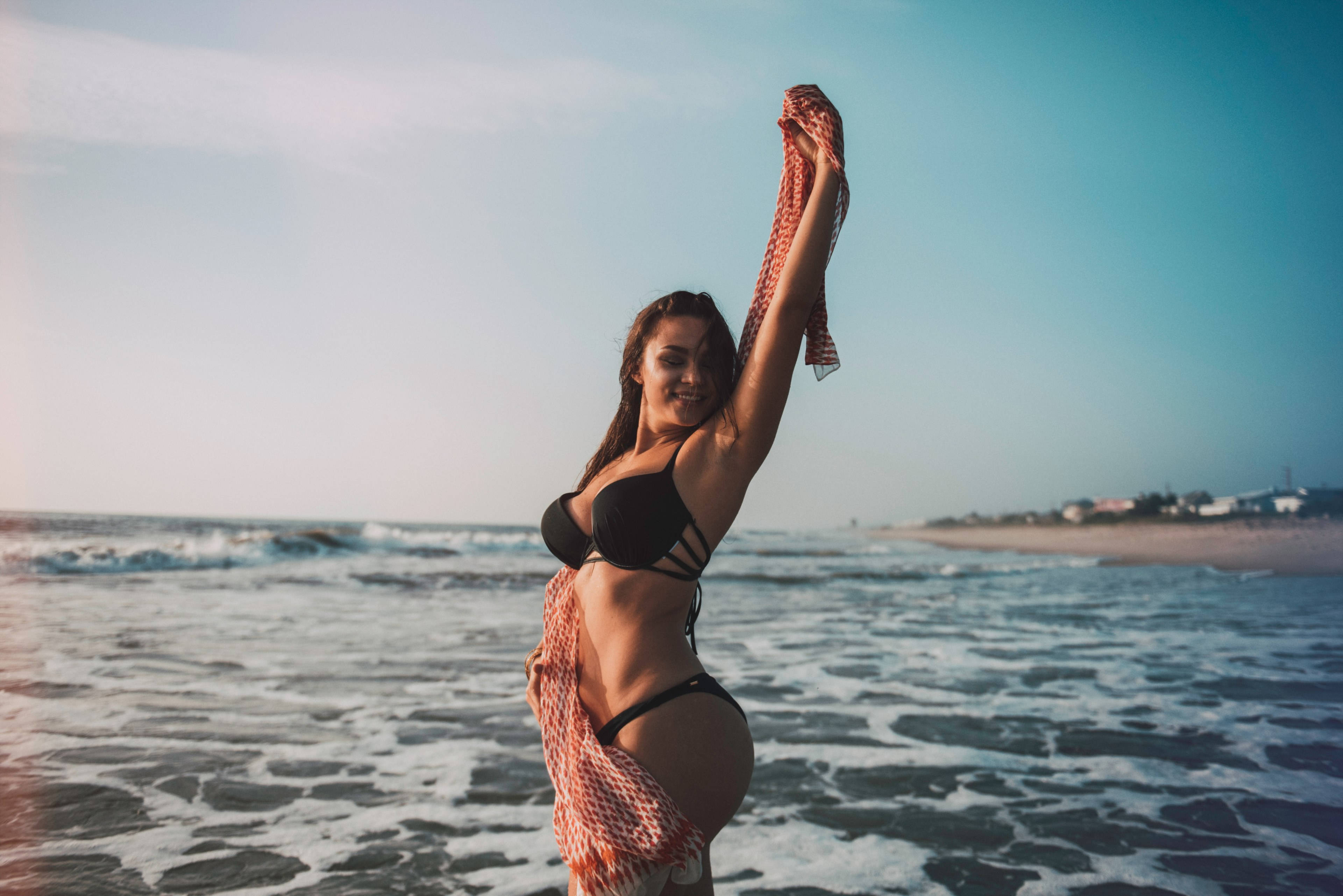 black bikini, coral patterned towel, sunlit beach, 4K Desktop Wallpaper