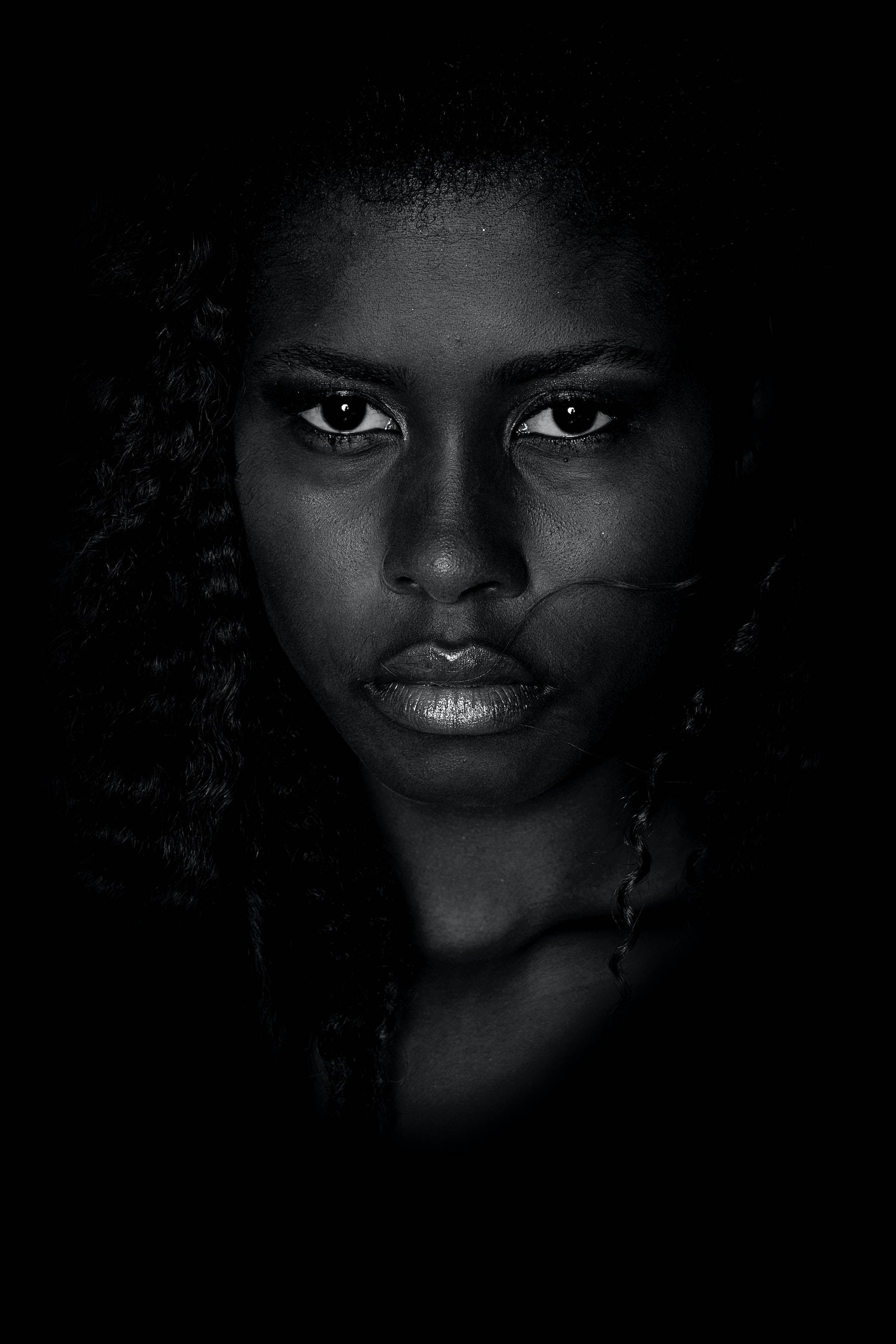black woman, rule of thirds shot, intense eyes, 2K Phone Wallpaper