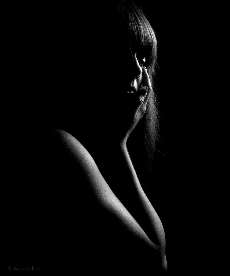 sensual and dark woman profile, stark black and white portrait, woman's face in shadow, SD Phone Wallpaper