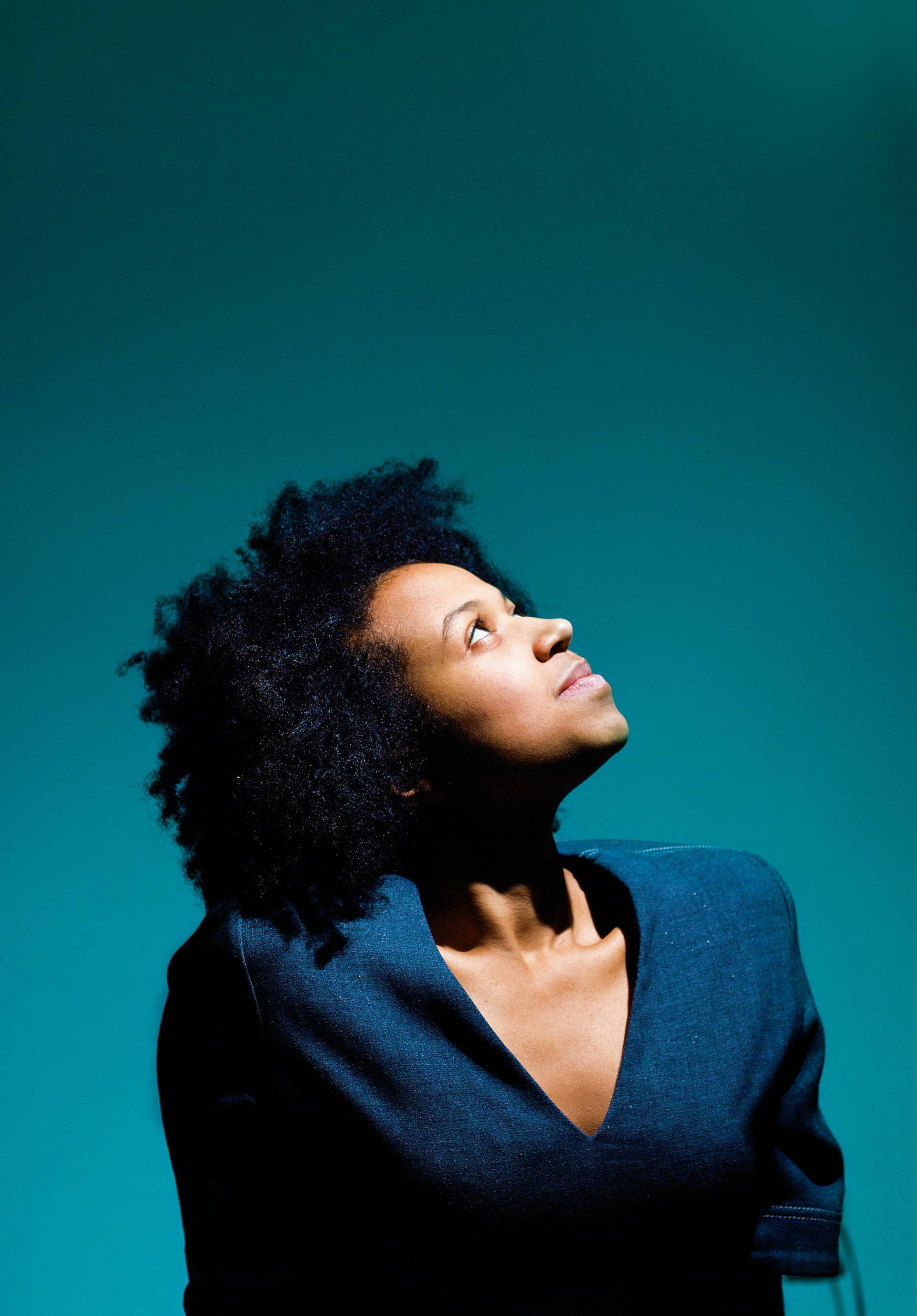 black woman aesthetic side profile, curly hair, teal background, 2K Phone Wallpaper