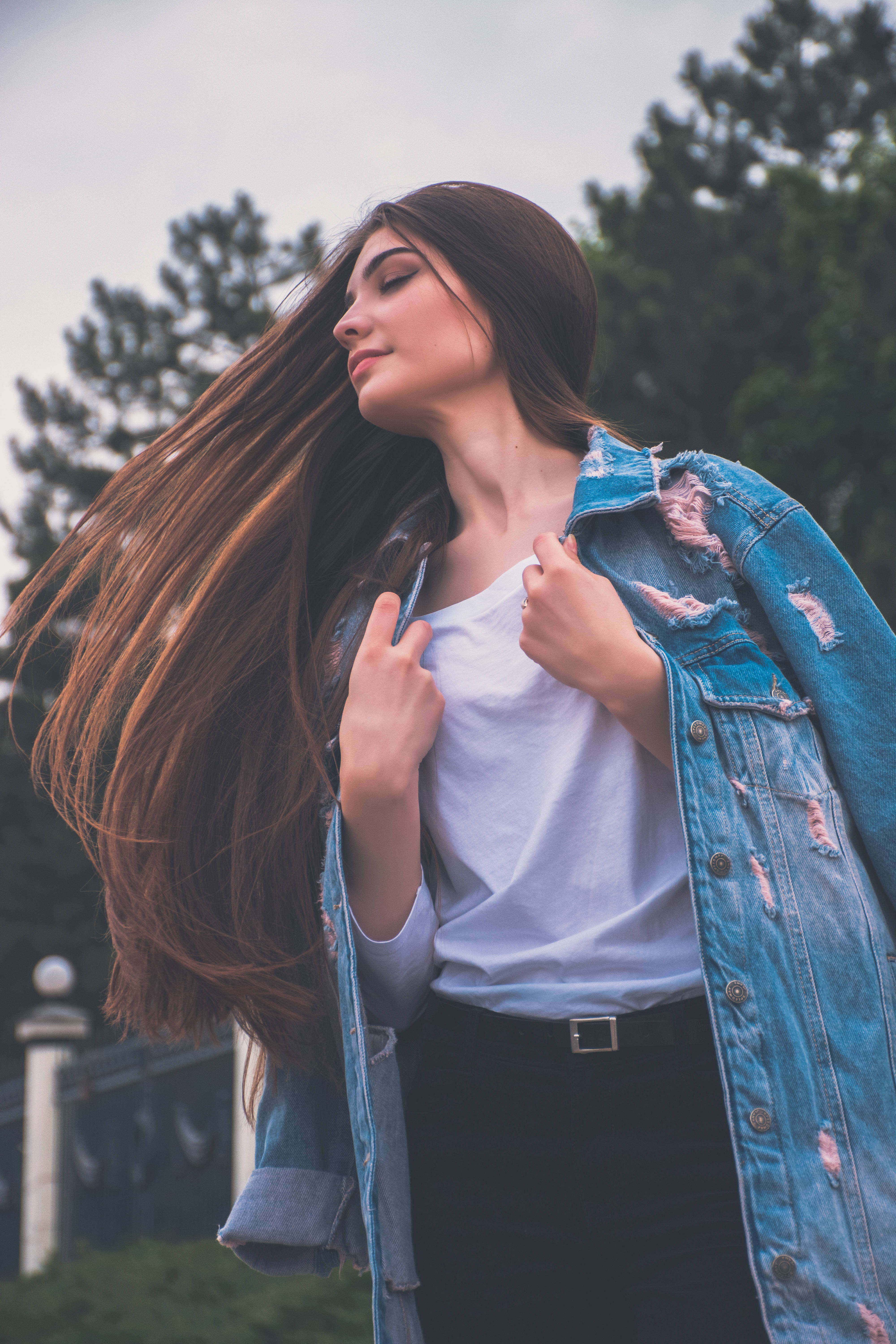 young woman, flowing brown hair, ripped denim jacket, 5K Phone Wallpaper