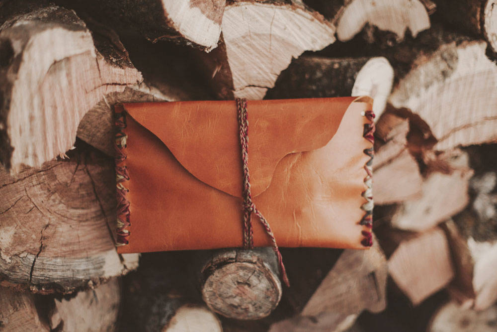 leather case, wooden logs, colorful braided trim, SD Desktop Wallpaper