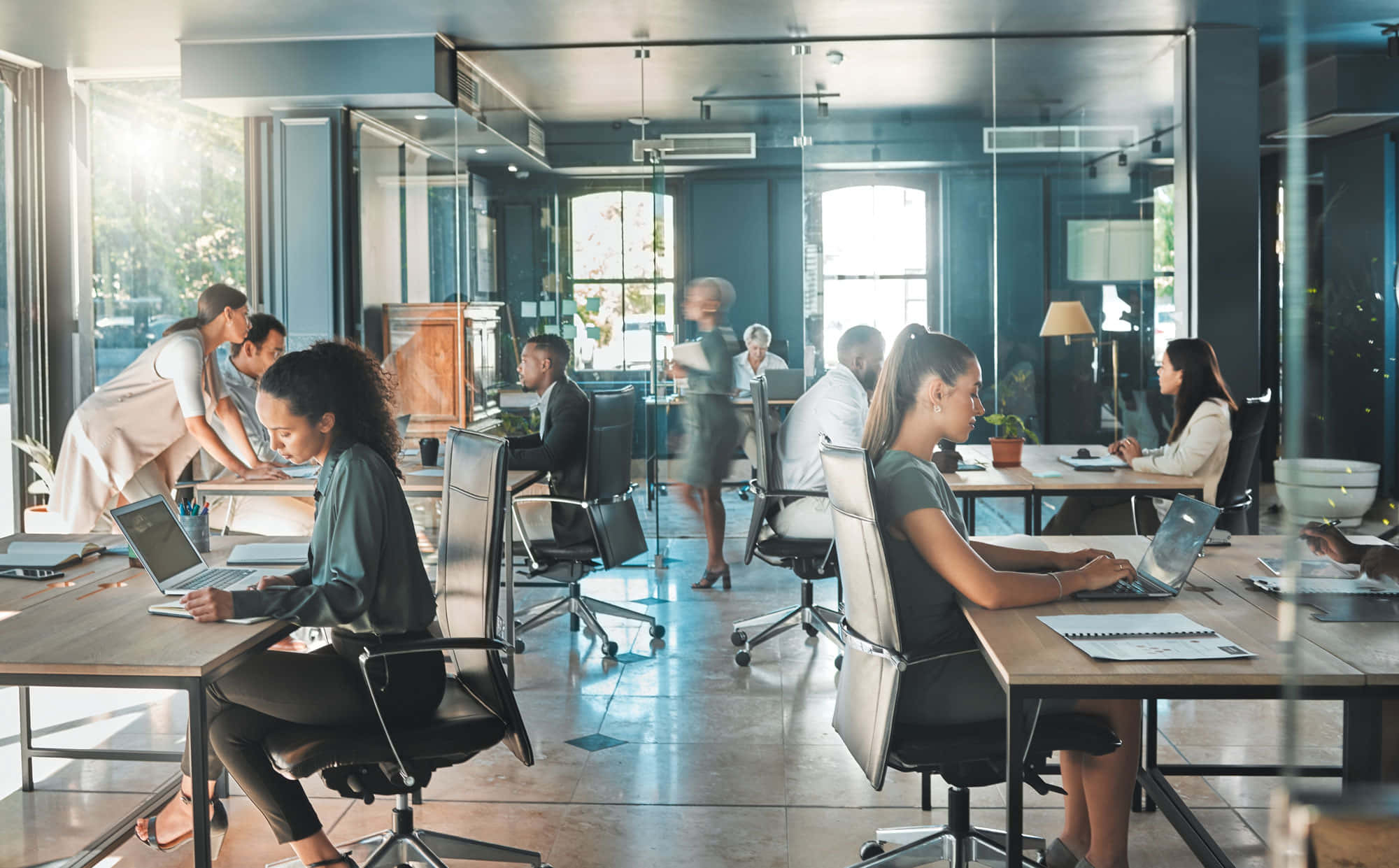 modern industrial office, sleek desks, bright natural light, Full HD Desktop Wallpaper