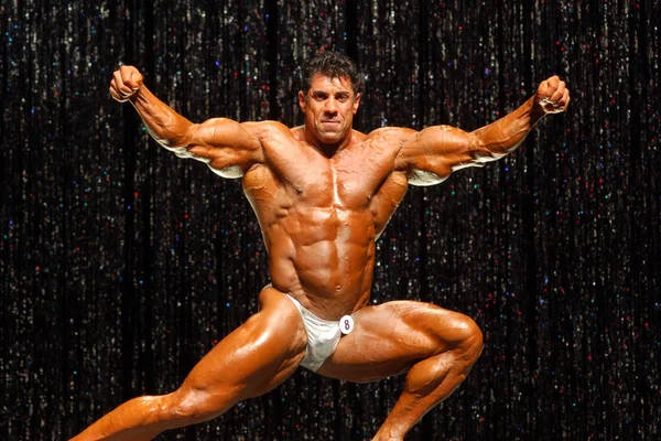 bodybuilders, stage lights, glittering backdrop, SD Desktop Wallpaper
