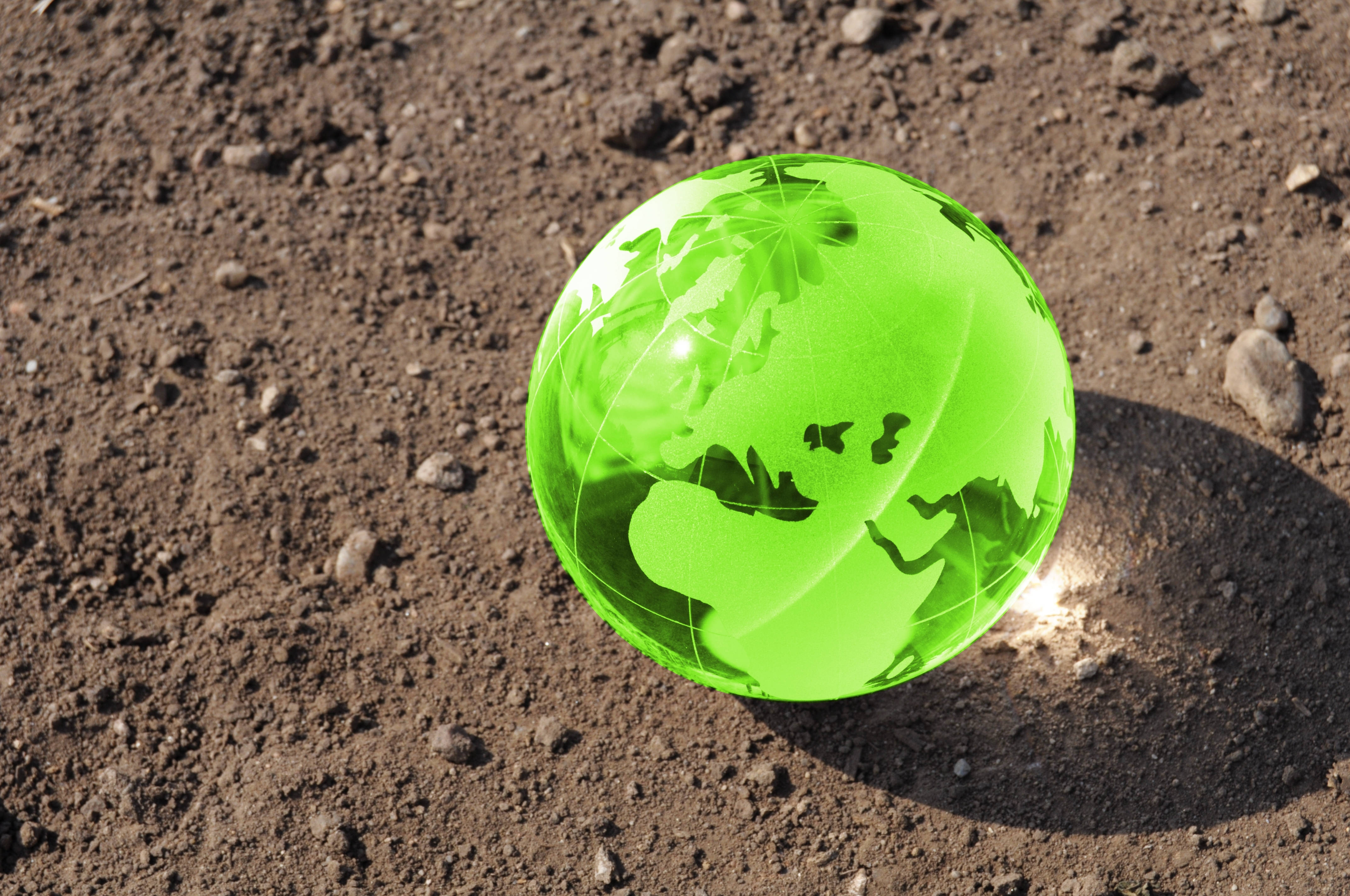 crystal ball, glowing green translucent globe, continents etched inside, 4K Desktop Wallpaper