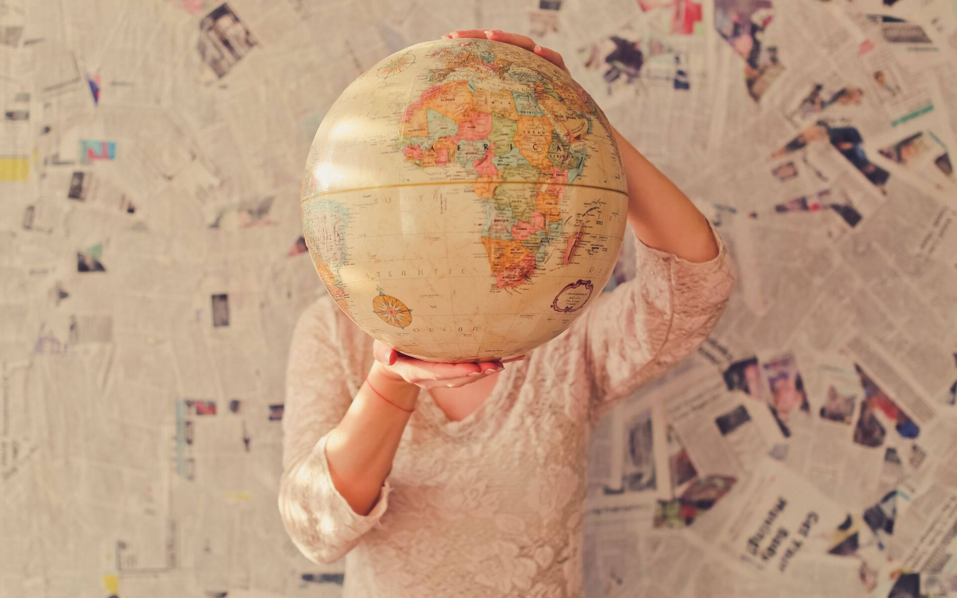 vintage globe, wall covered in newspaper clippings, person, Full HD Desktop Wallpaper