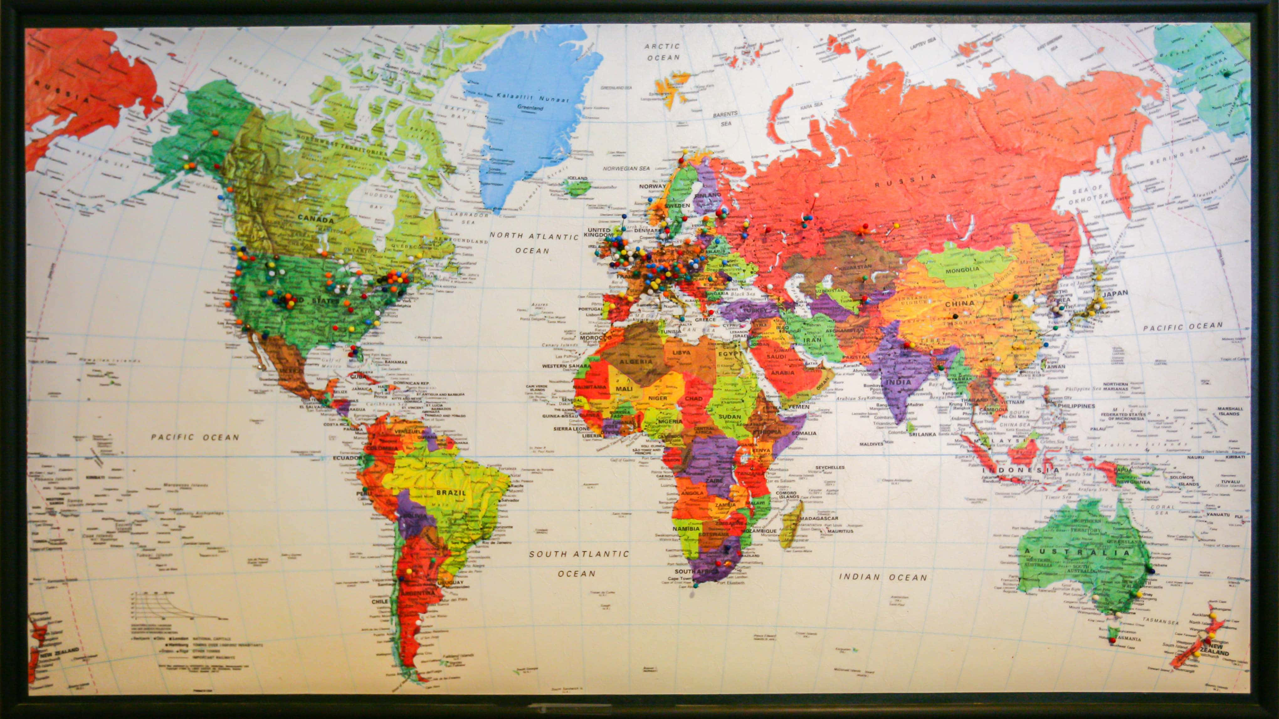 colorful world map, travel pins, dark frame, 4K Desktop Wallpaper