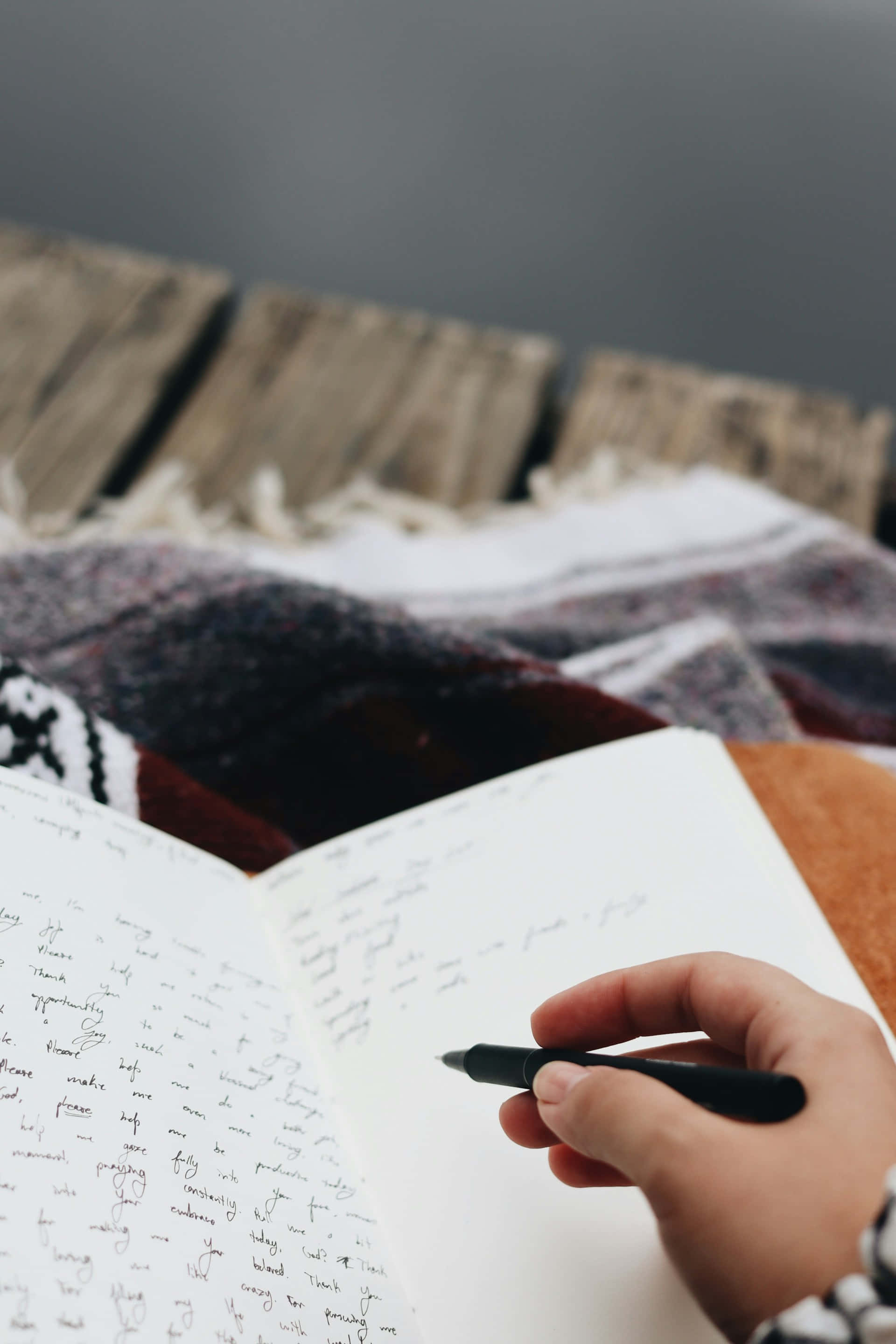 black pen, handheld journal, patterned blanket, 2K Phone Wallpaper