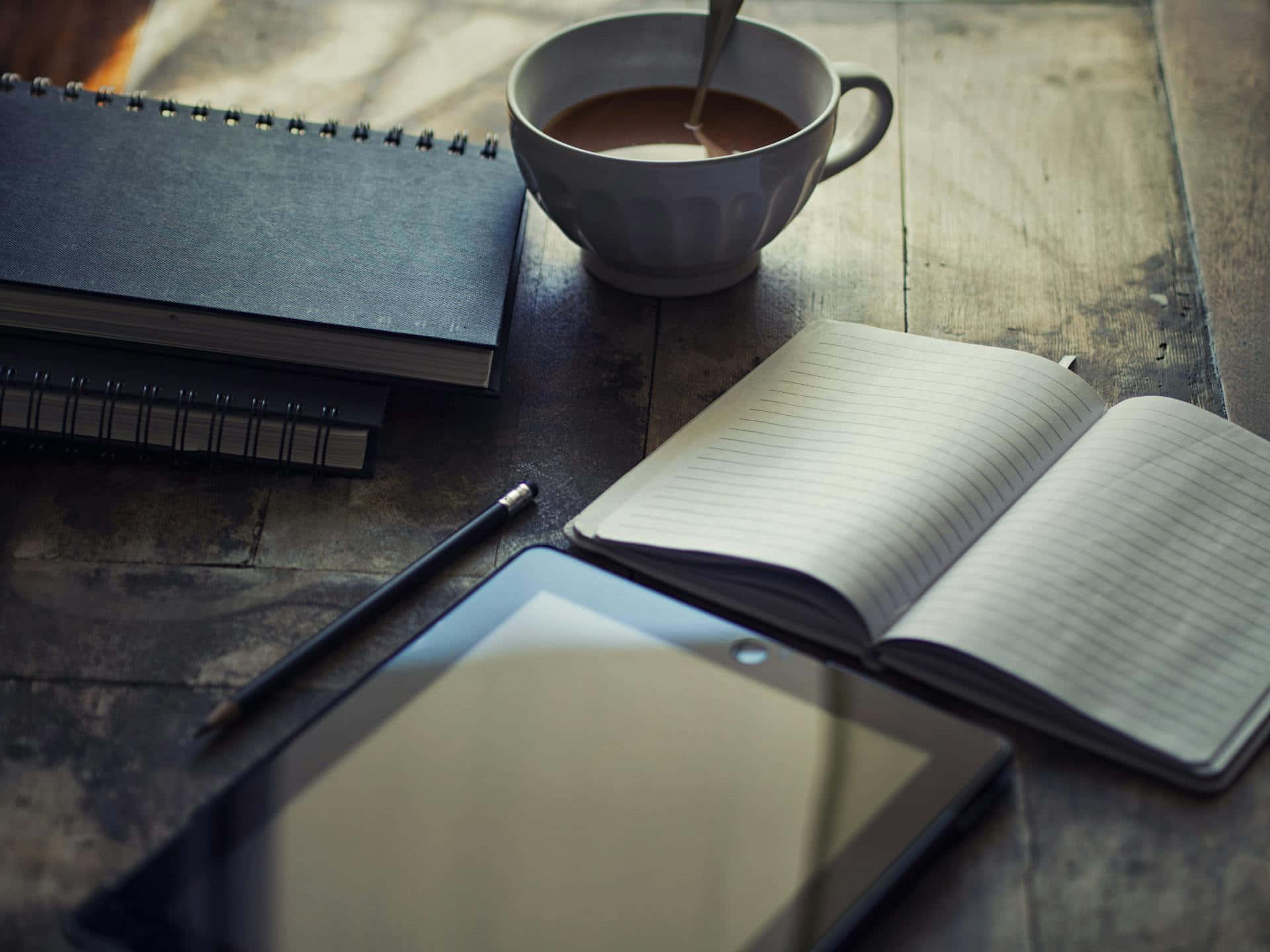creative writing workspace setup, steaming coffee cup, spiral notebooks, Full HD Desktop Wallpaper