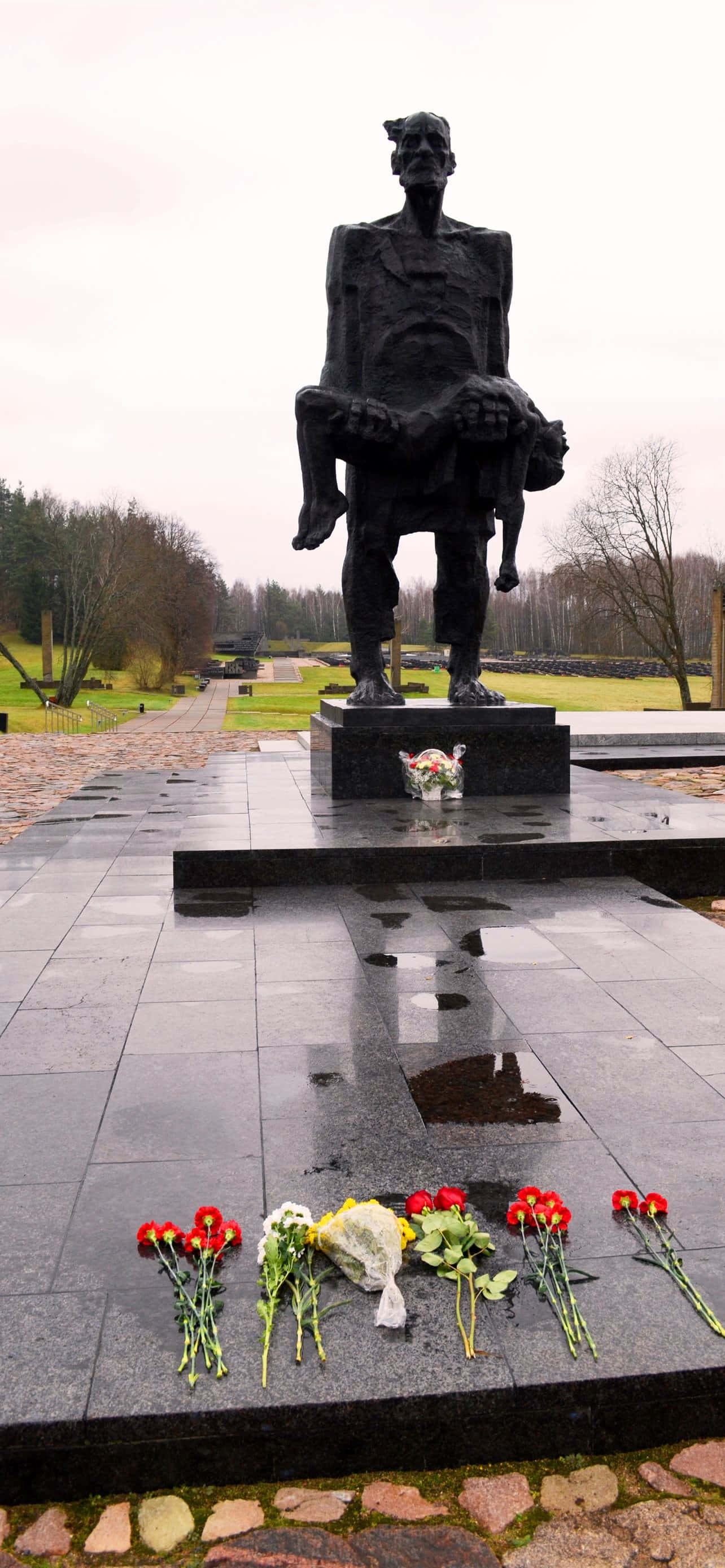 WW2 iPhone, black statue, man holding child, 2K Phone Wallpaper