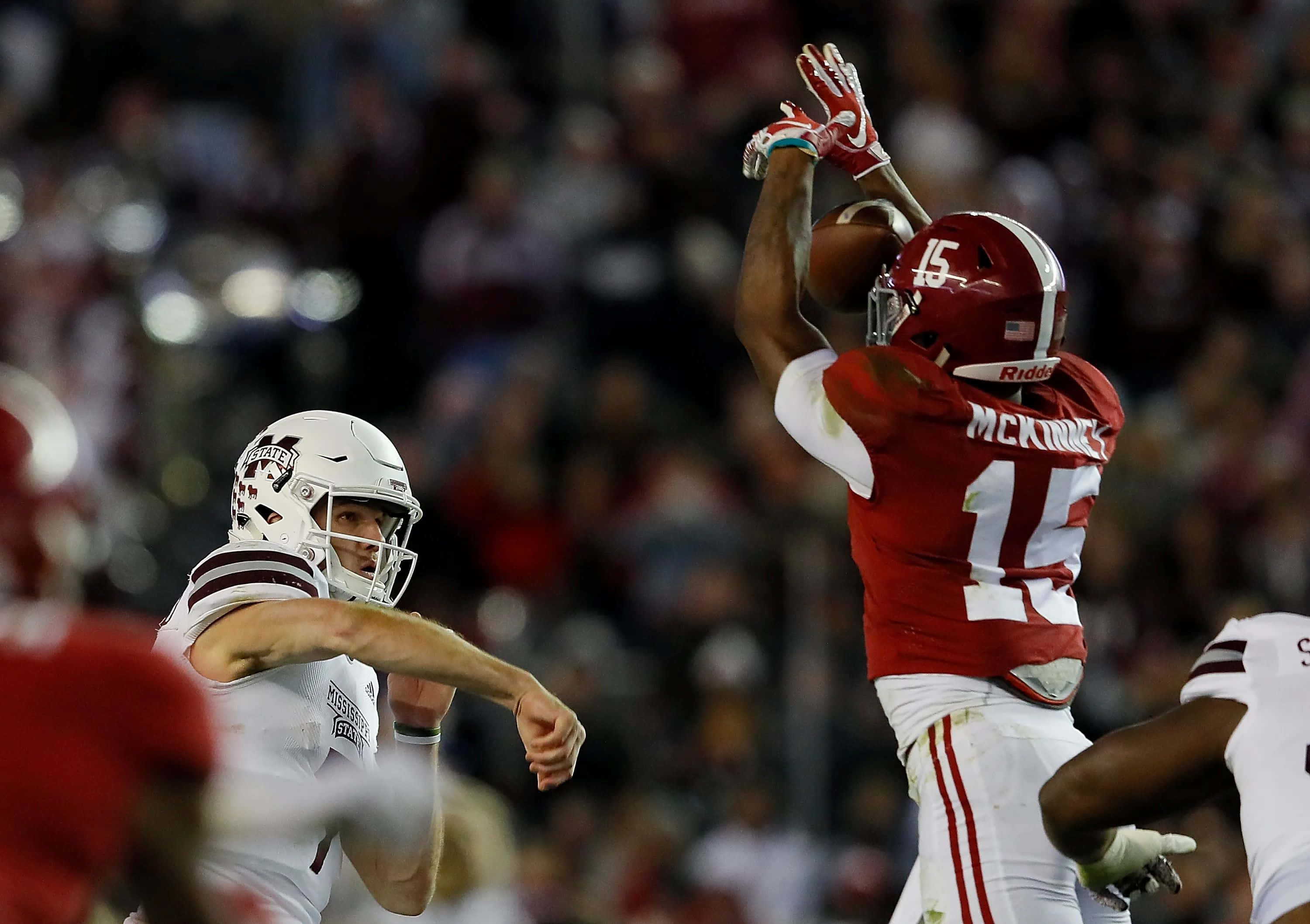 Xavier Mckinney, red jersey number 15, quarterback in white, 2K Desktop Wallpaper