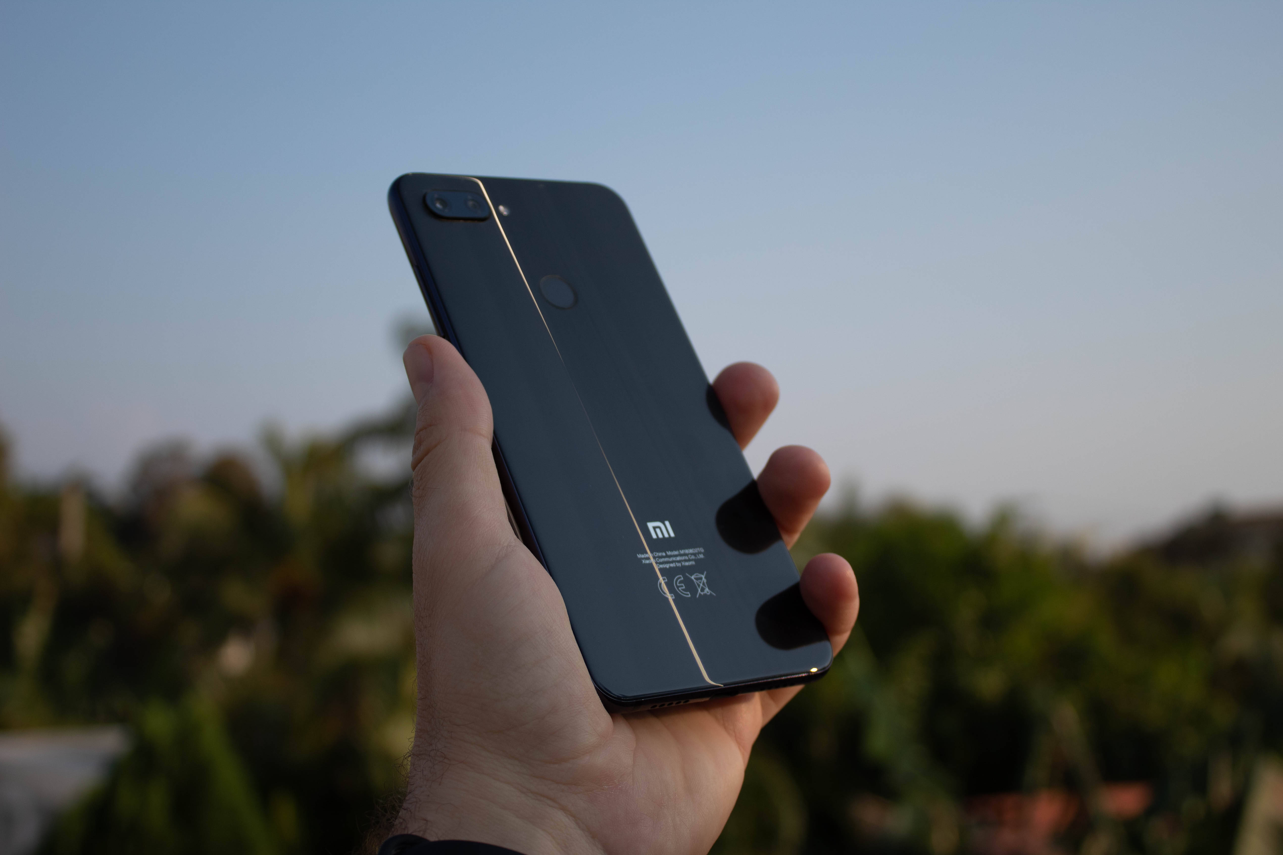 Xiaomi smartphone, black, hand, 5K Desktop Wallpaper