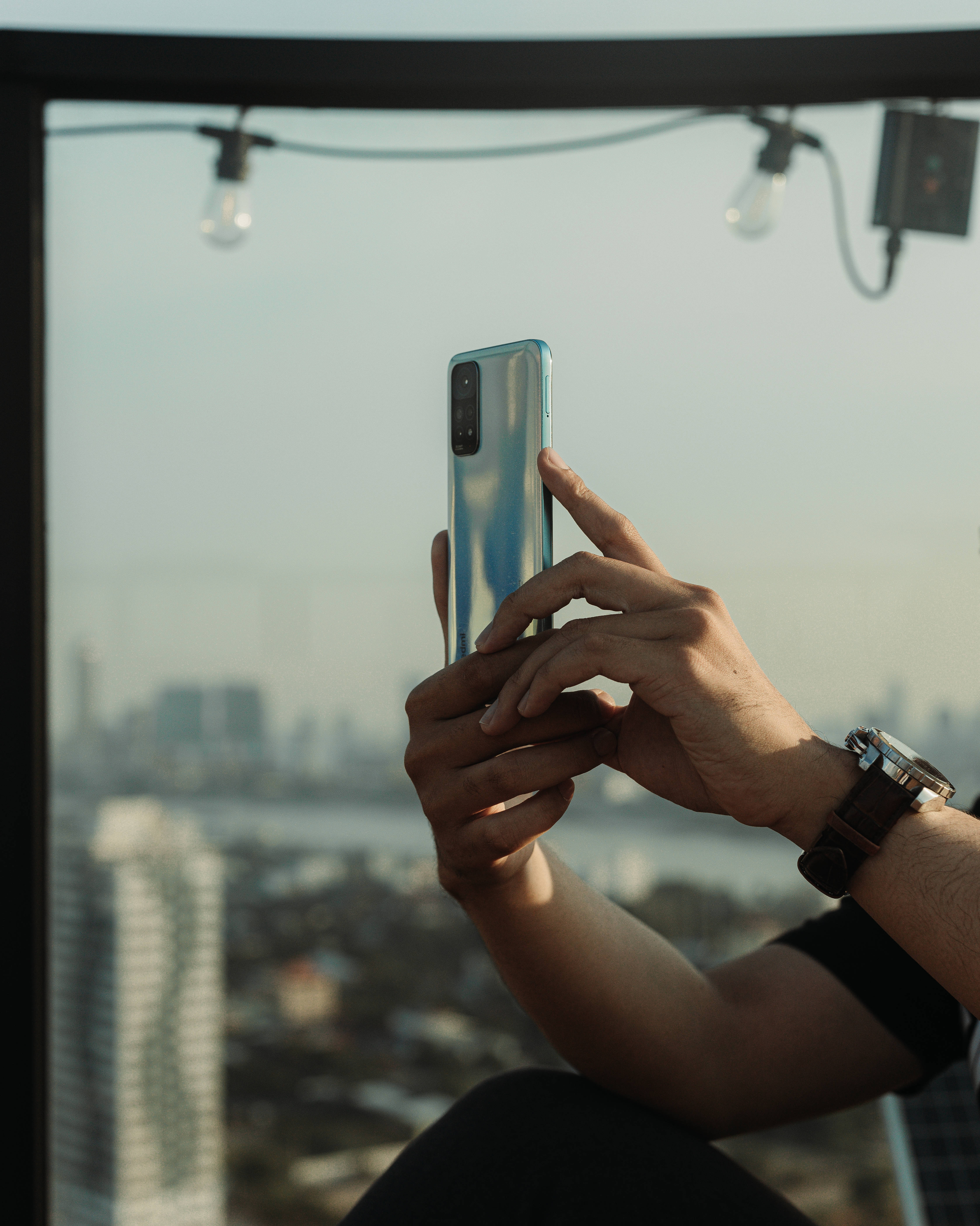 Xiaomi smartphone, blue phone, hazy cityscape, 5K Phone Wallpaper