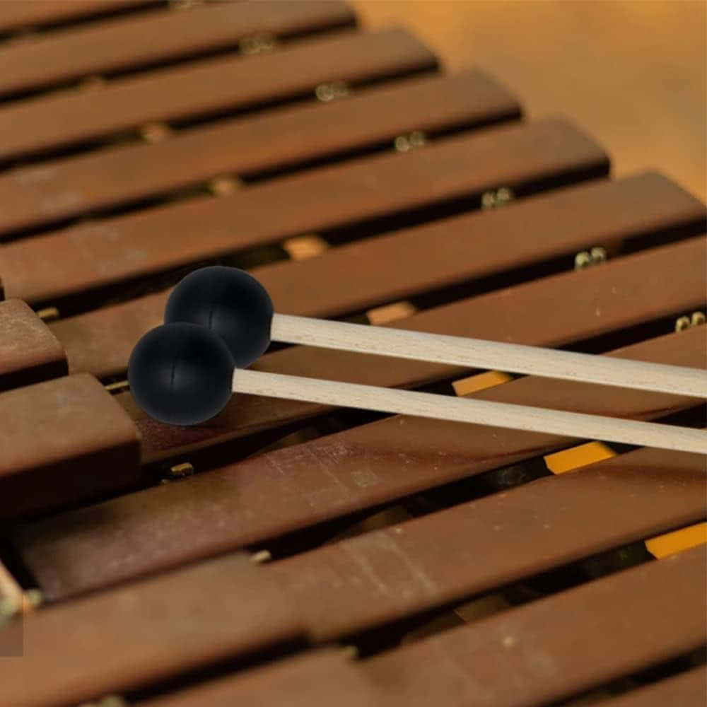 black-tipped mallets, warm-toned wooden xylophone bars, shallow depth of field, SD Desktop Wallpaper