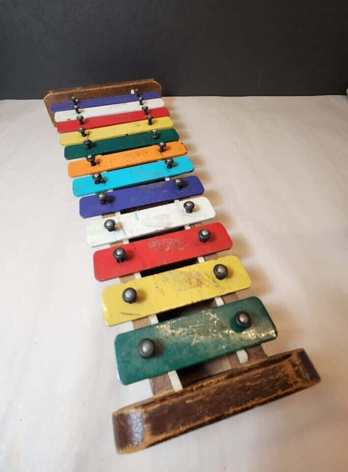 colorful wooden xylophone, rainbow-colored keys, vintage wooden xylophone, SD Phone Wallpaper