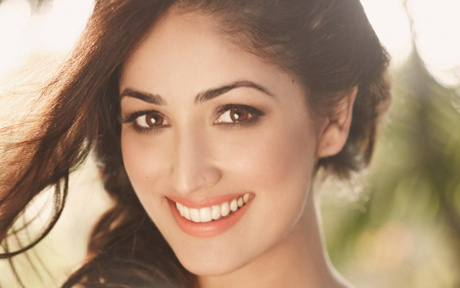 Yami Gautam, flowing brown hair, soft blurred green background, Full HD Desktop Wallpaper
