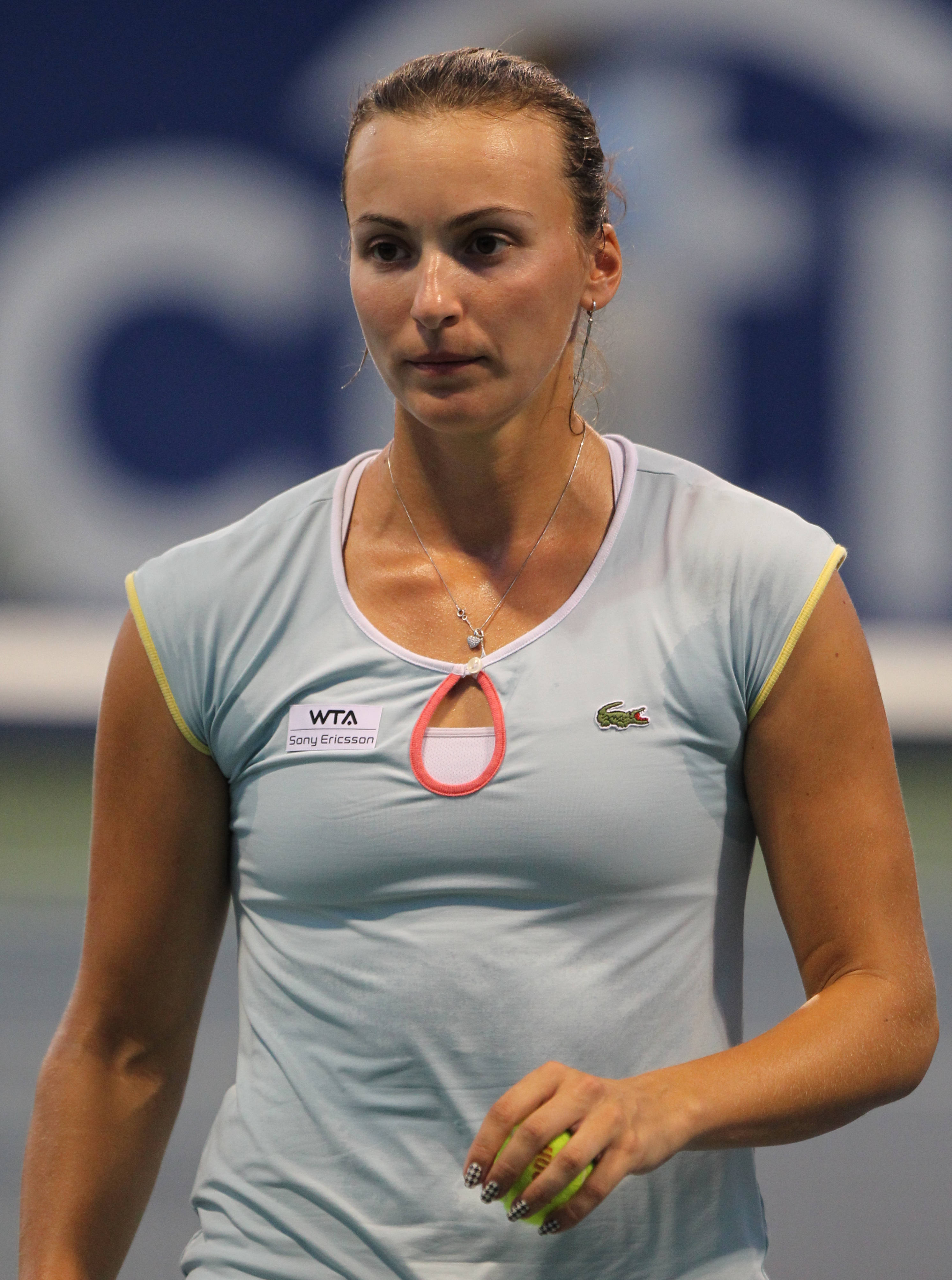 Yaroslava Shvedova, light blue shirt, yellow tennis ball, 4K Phone Wallpaper