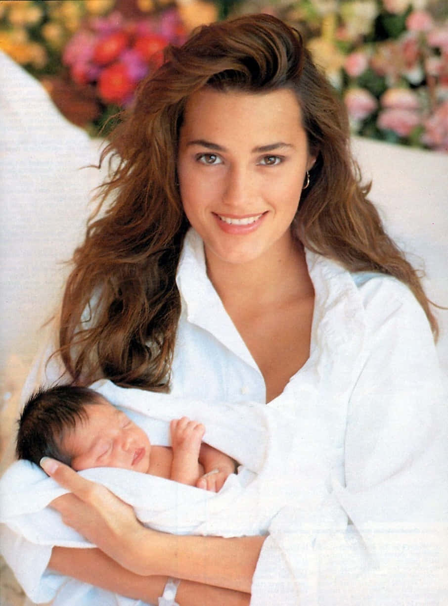 Yasmin Le Bon, long brown hair, sleeping newborn, SD Phone Wallpaper