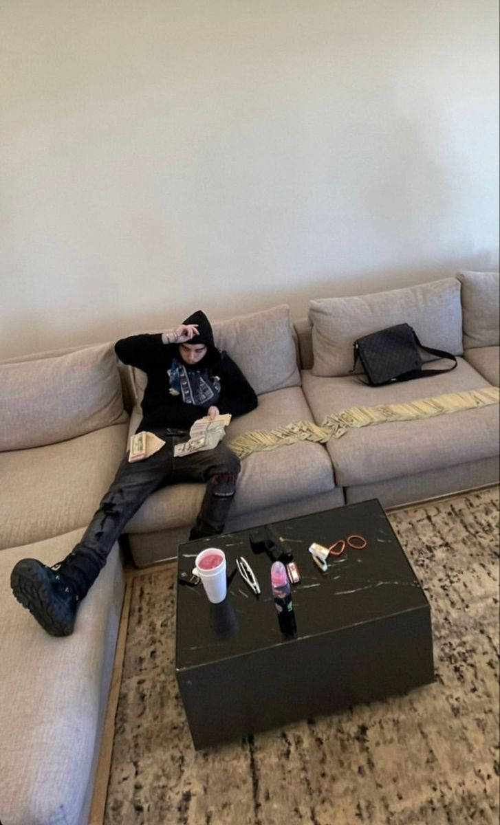 Yeat, black hoodie, beige couch, SD Phone Wallpaper