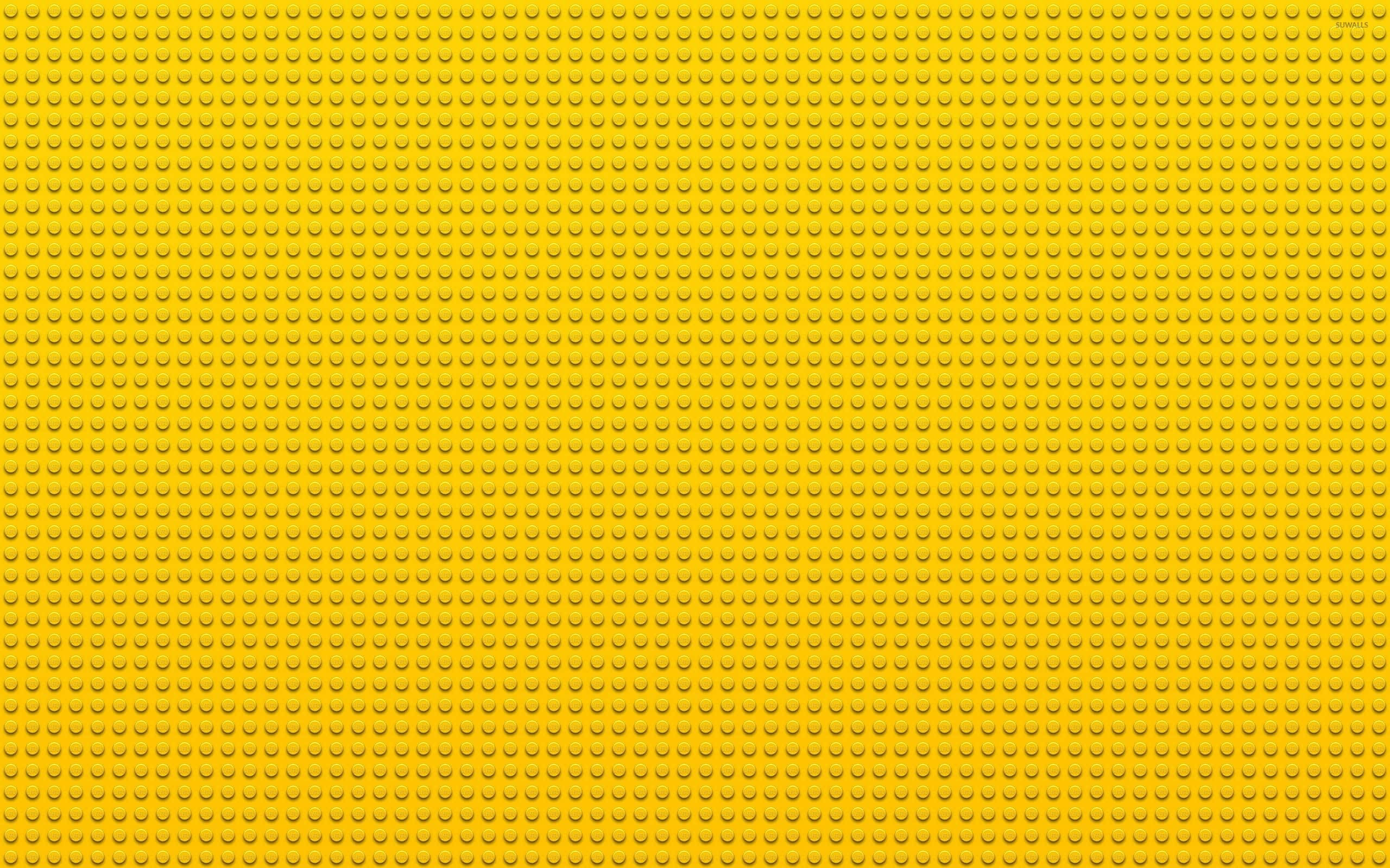 yellow Lego baseplate, repeating circular studs, seamless, 2K Desktop Wallpaper