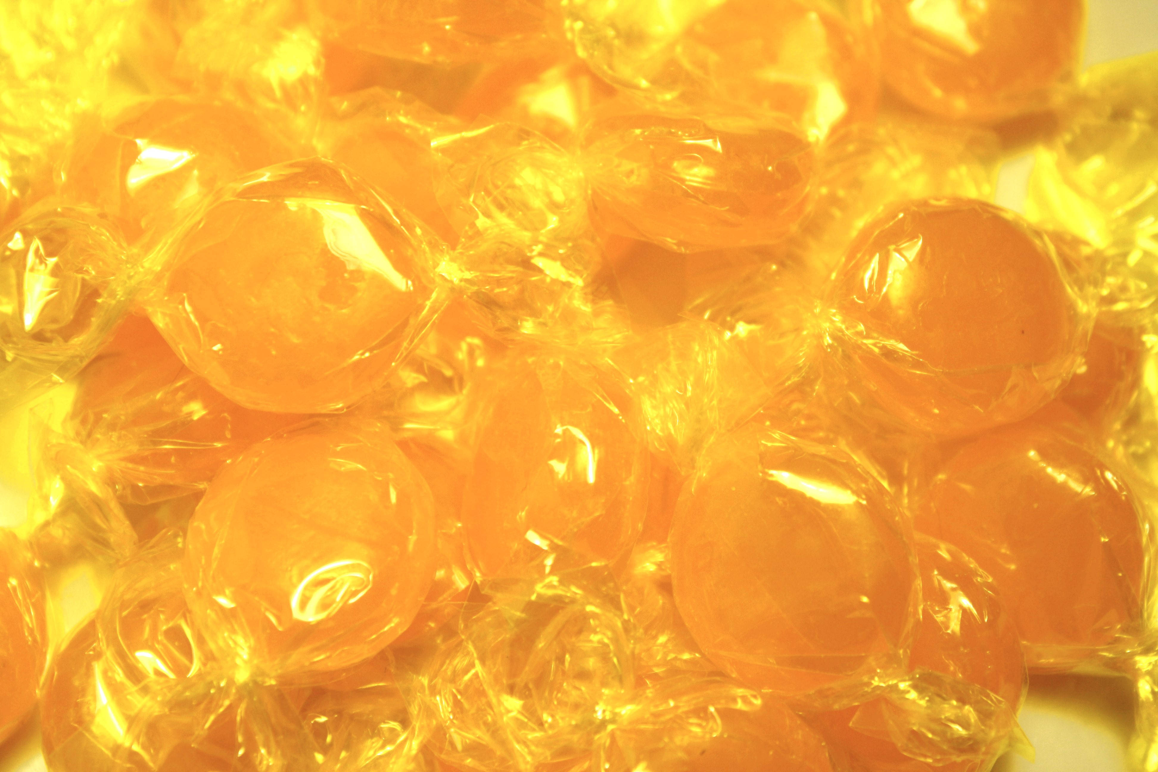 yellow aesthetic laptop, yellow candy, glossy orange candies, 4K Desktop Wallpaper