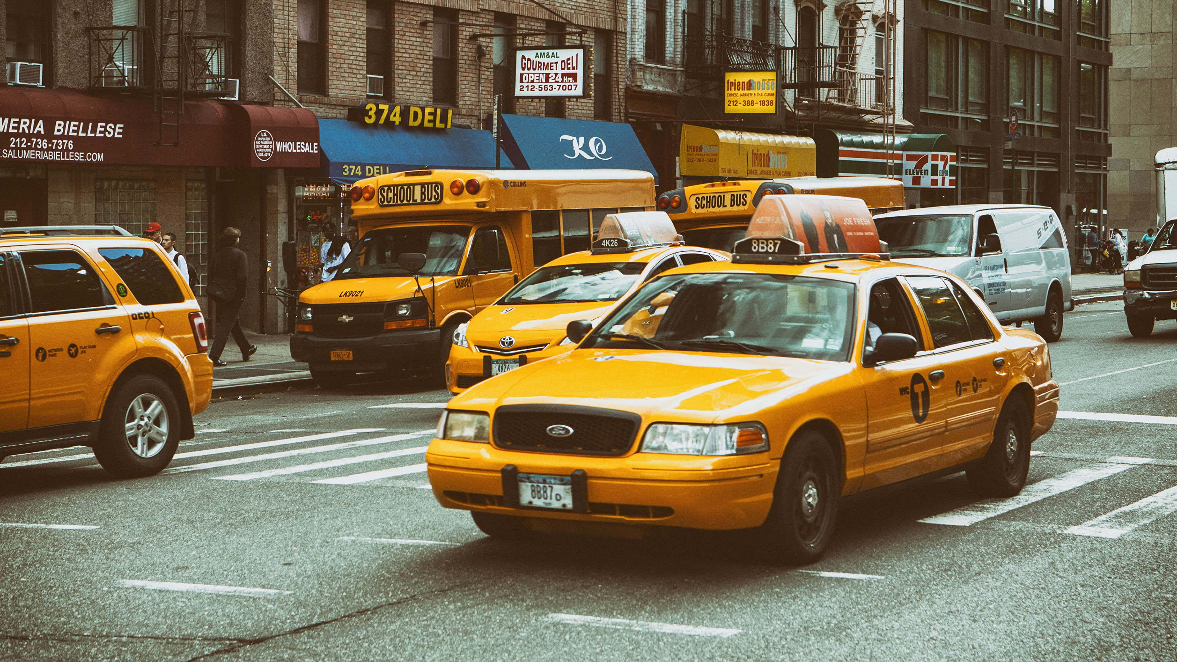 Yellow Cab, city streets, brick buildings, 4K Desktop Wallpaper