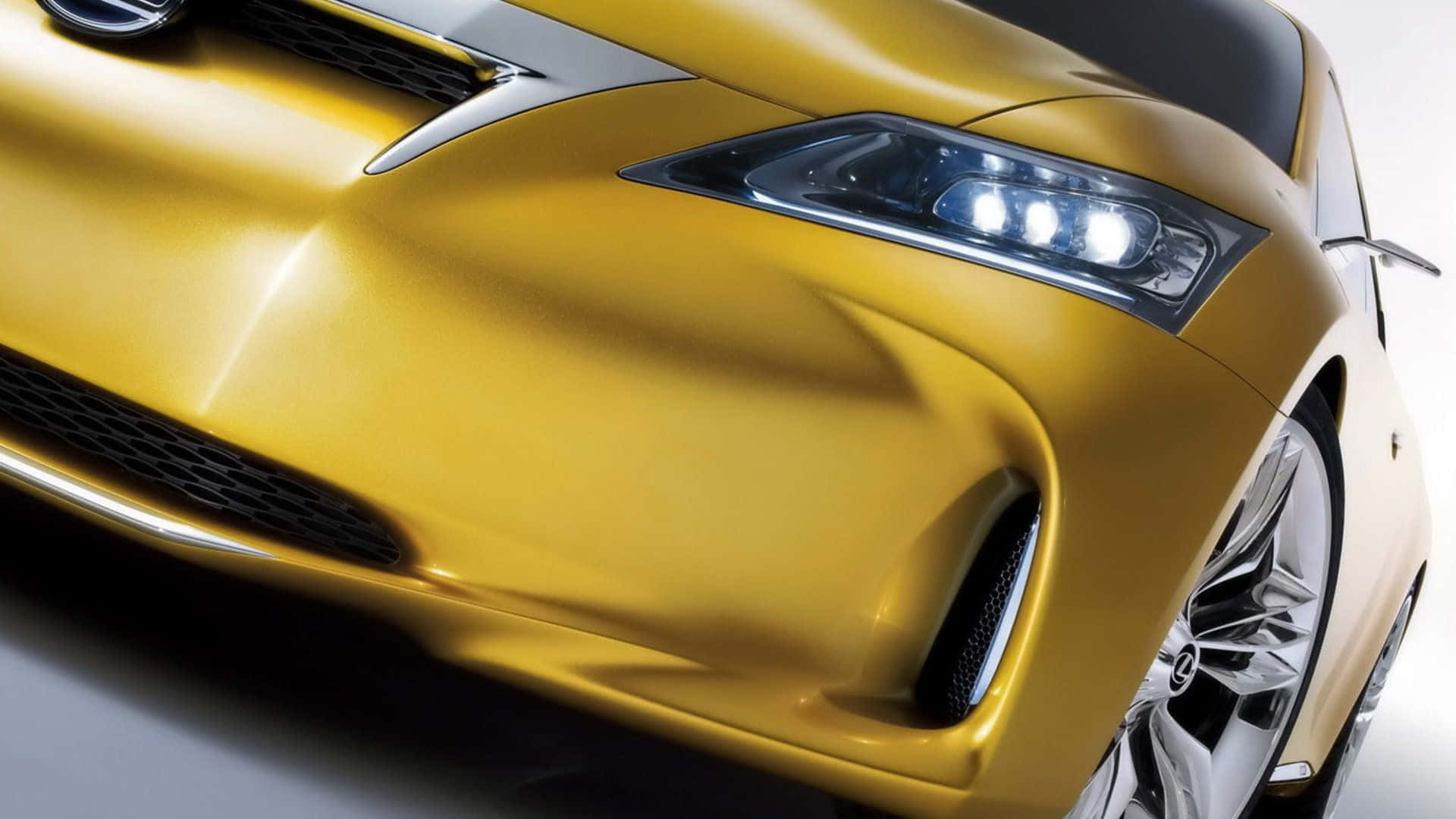 sleek golden sports car, sharp headlights, aerodynamic curves, Full HD Desktop Wallpaper
