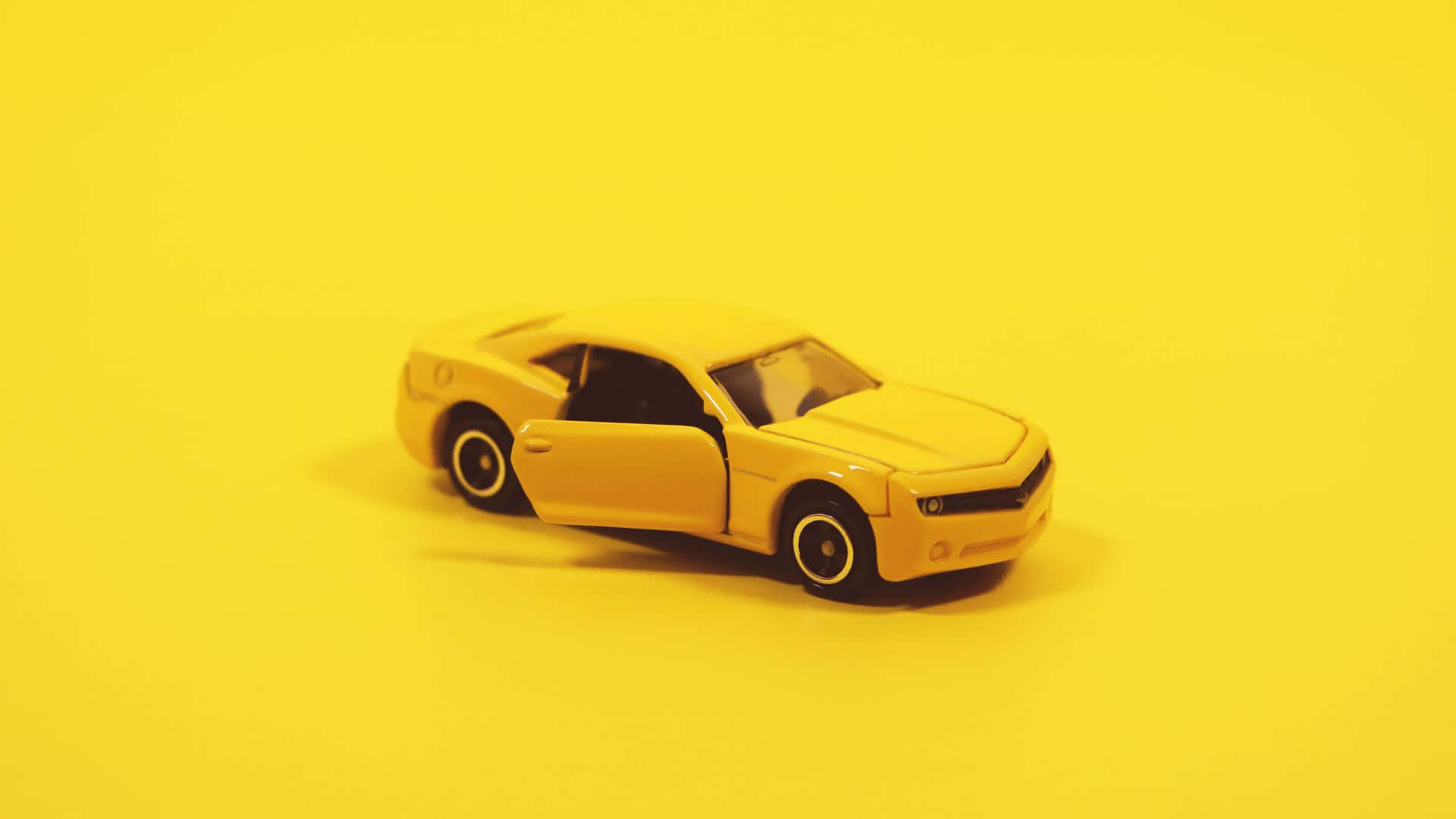 yellow toy sports car, open door, solid yellow background, Full HD Desktop Wallpaper