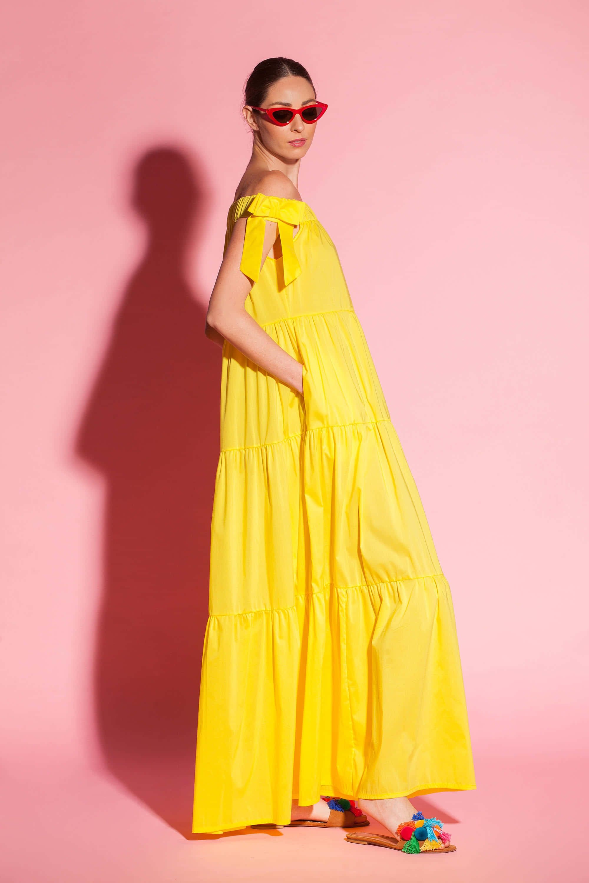 vibrant yellow haute couture outfit, bright yellow tiered dress, red sunglasses, 2K Phone Wallpaper