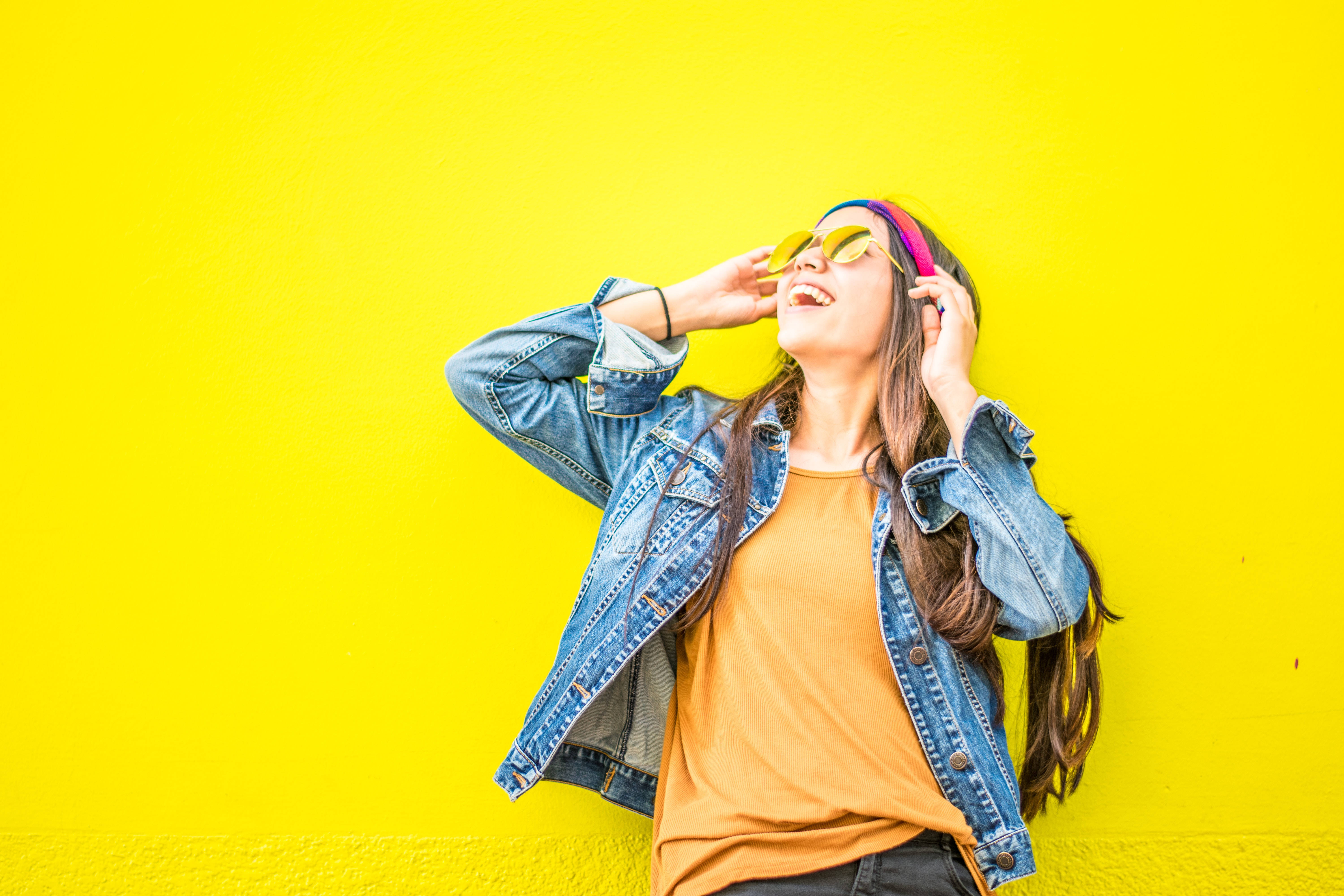 denim jacket, yellow sunglasses, vibrant yellow wall, 5K Desktop Wallpaper