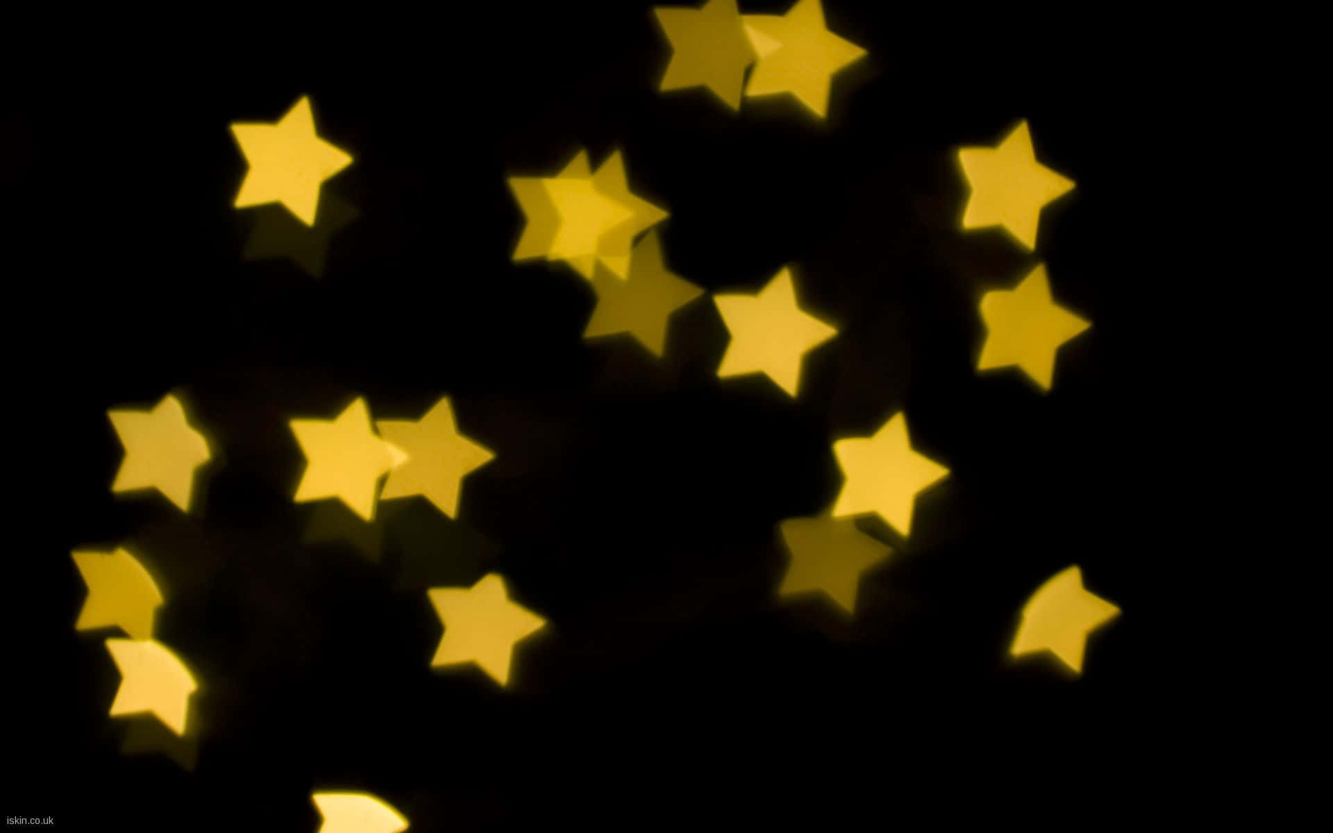 pastel yellow, golden star-shaped lights, deep black background, Full HD Desktop Wallpaper