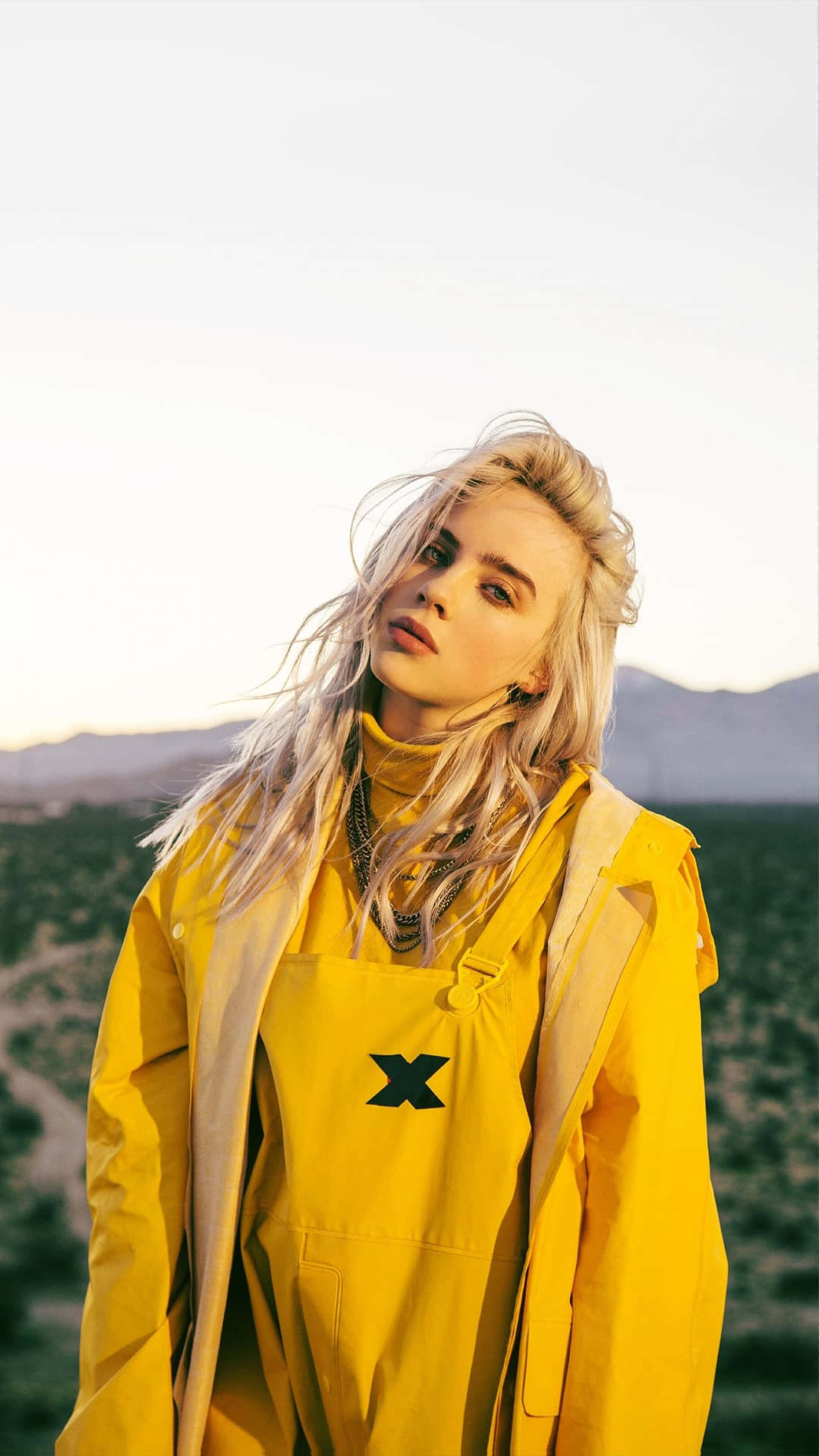 yellow raincoat, blonde woman, desert backdrop, 4K Phone Wallpaper