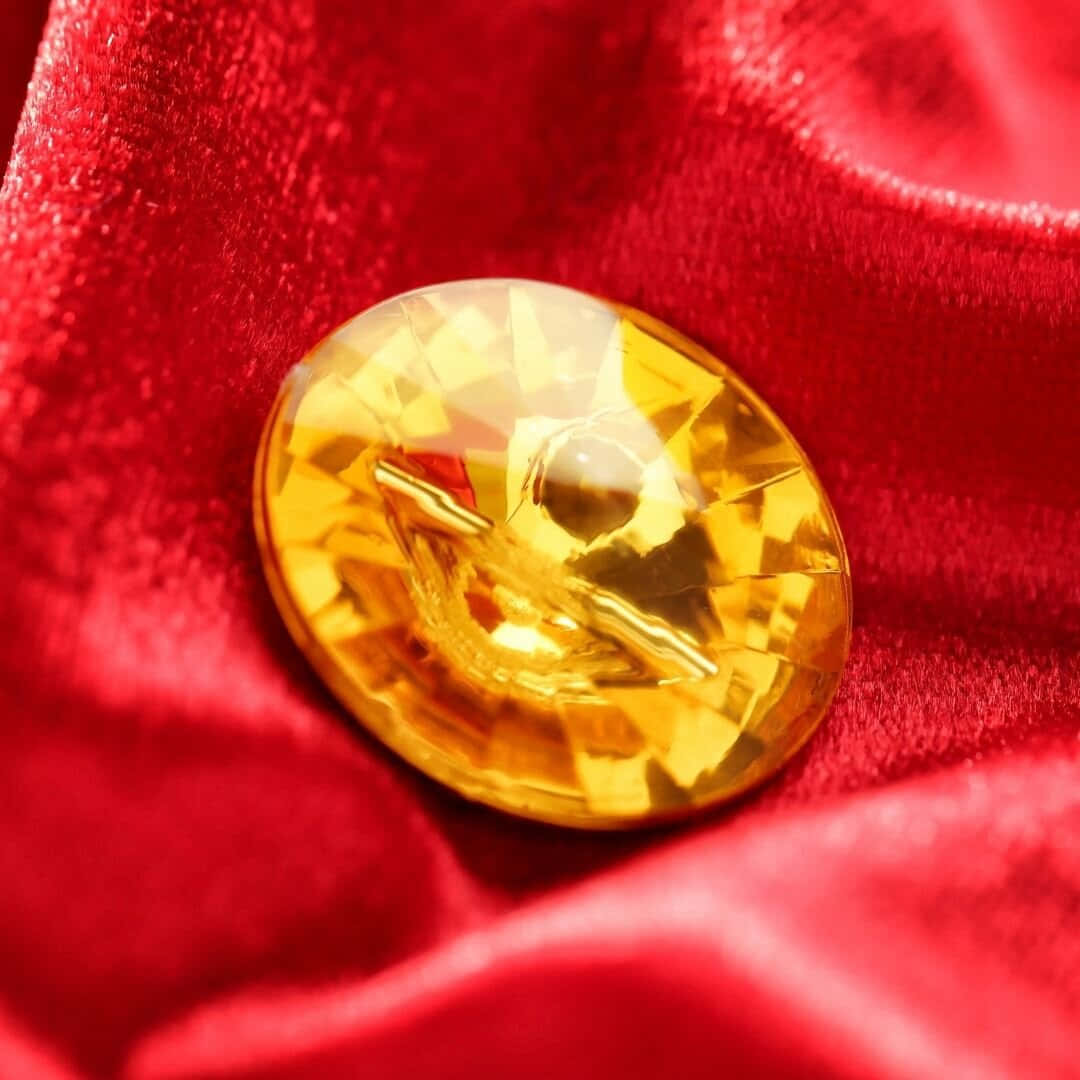 Yellow Sapphire, golden-yellow crystal gem, red velvet fabric, SD Desktop Wallpaper