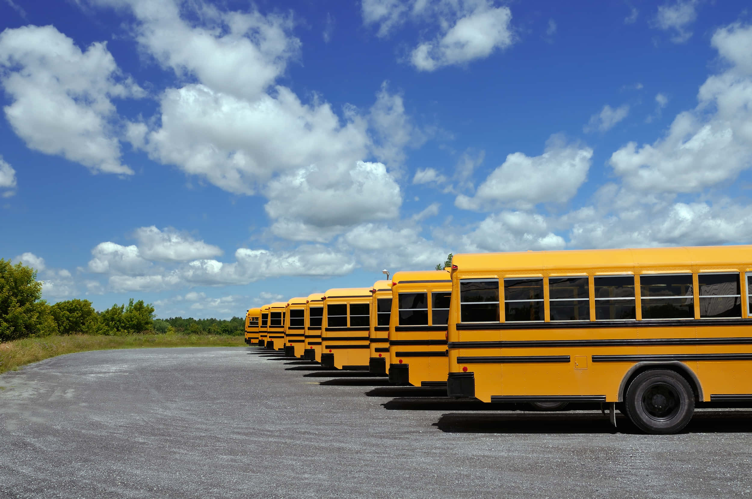 yellow school bus, gravel lot, bright blue sky, Full HD Desktop Wallpaper