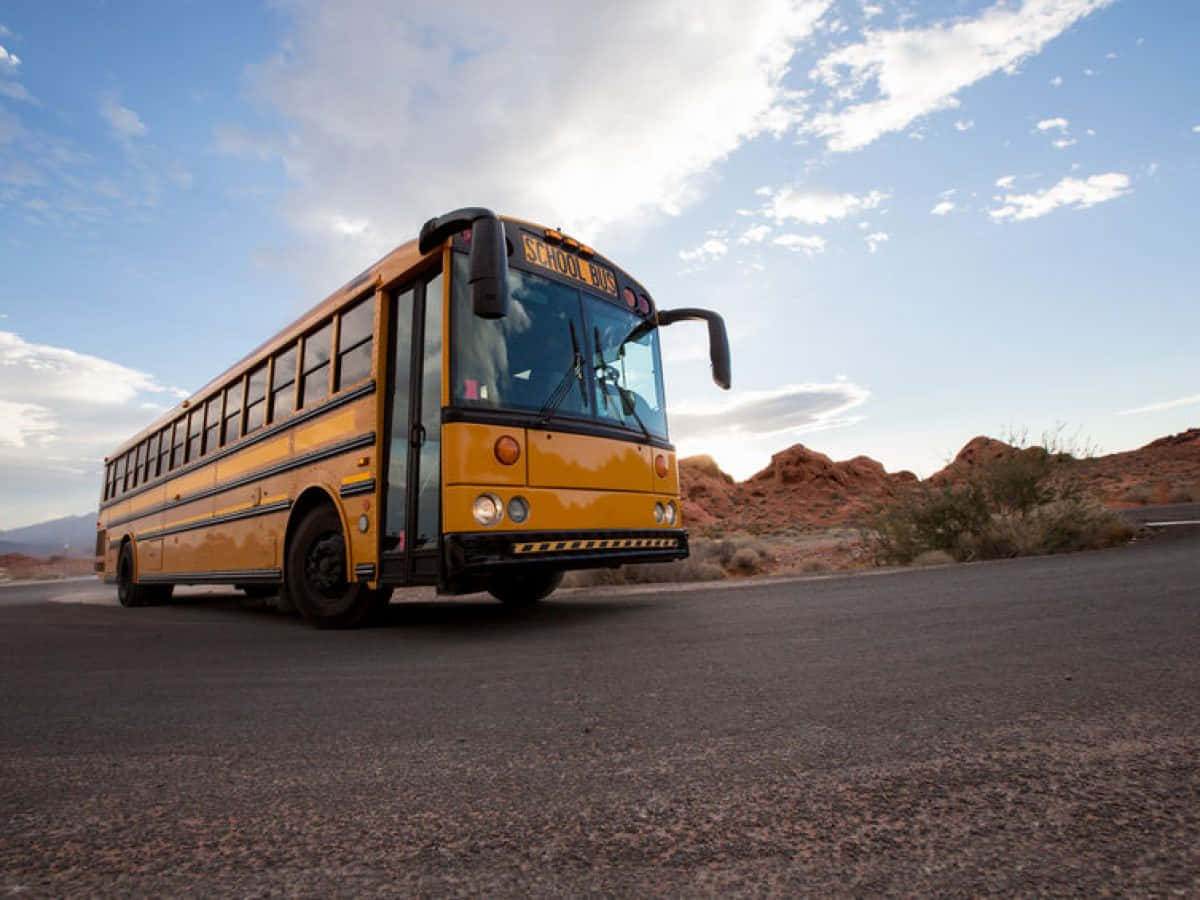 yellow school bus, desert road, bright blue sky, SD Desktop Wallpaper
