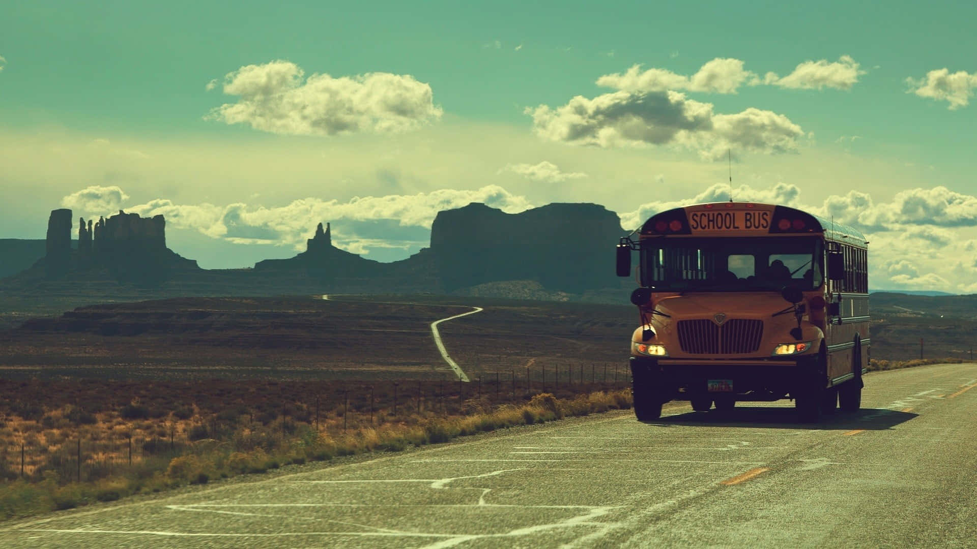 yellow school bus, desert highway, distant buttes, Full HD Desktop Wallpaper