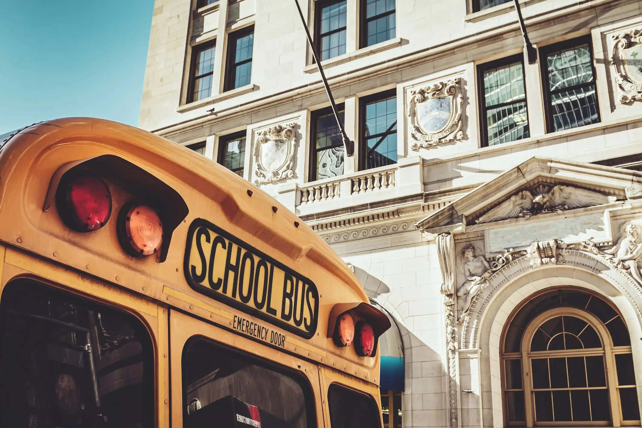 yellow school bus, red lights, grand ornate stone building, Full HD Desktop Wallpaper