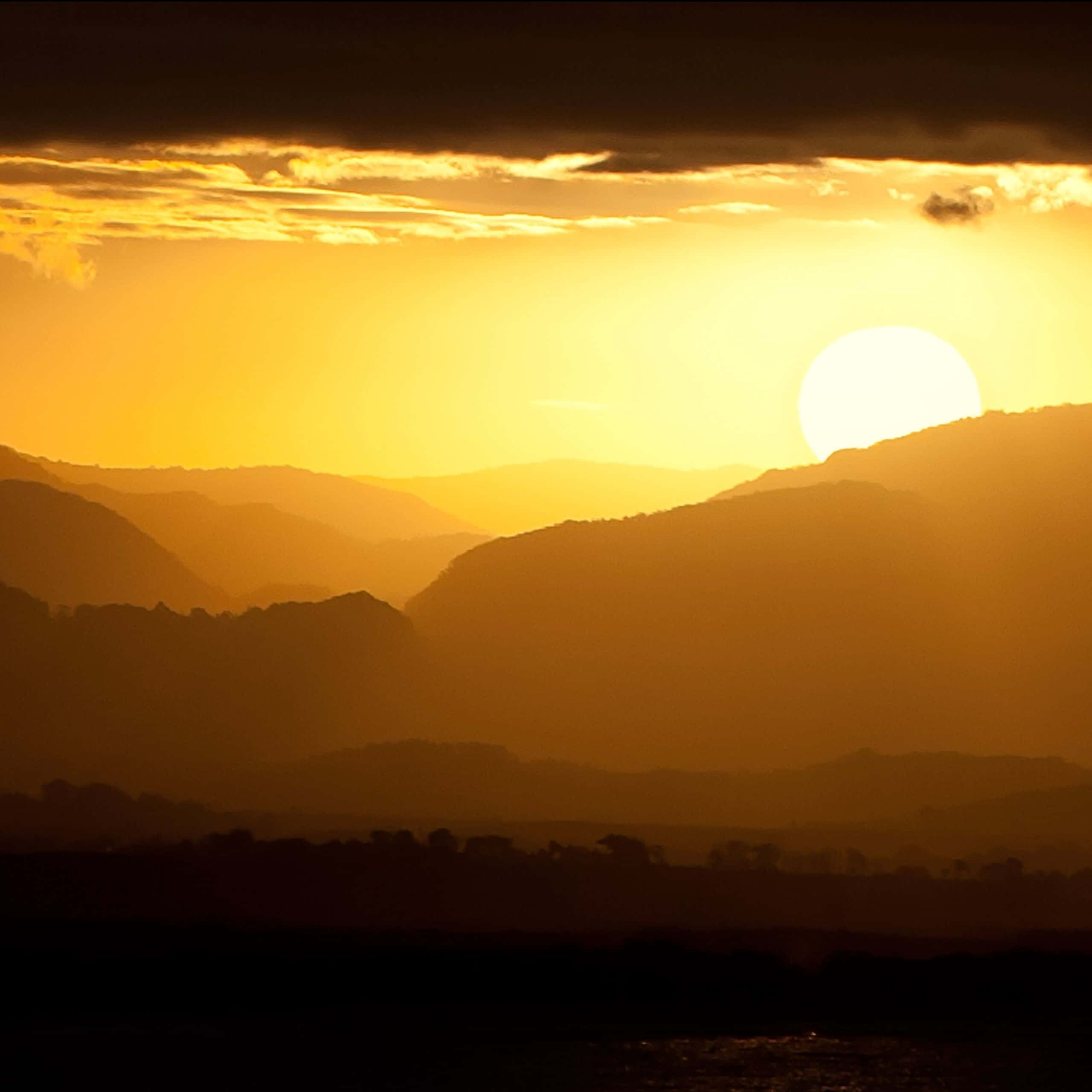 Yellow Sunset, golden sunset, layered mountain silhouettes, 2K Desktop Wallpaper