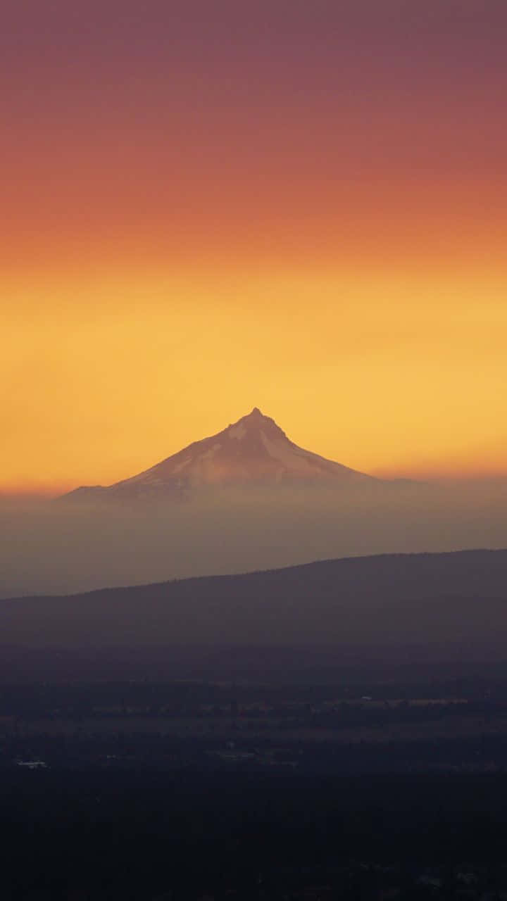 Yellow Sunset, firey orange and purple sunset sky, snowcapped mountain peak, HD Phone Wallpaper