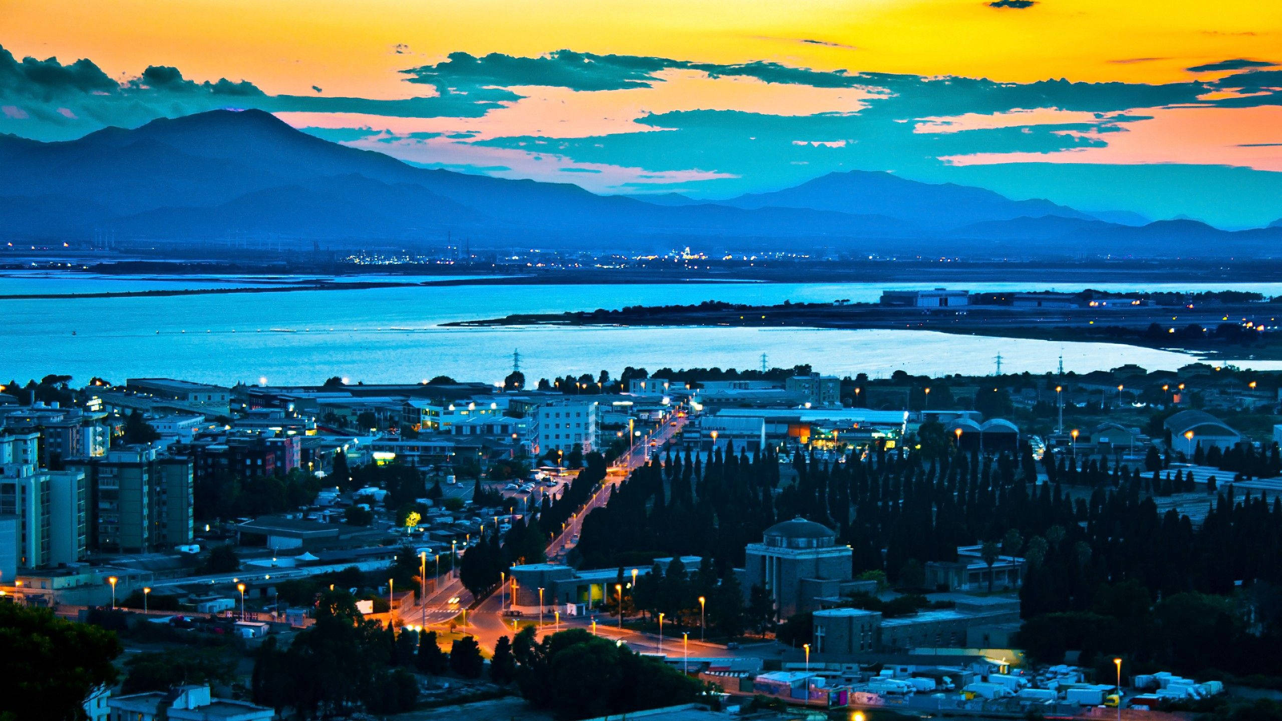 Yellow Sunset, twilight cityscape, glowing streetlights, 2K Desktop Wallpaper